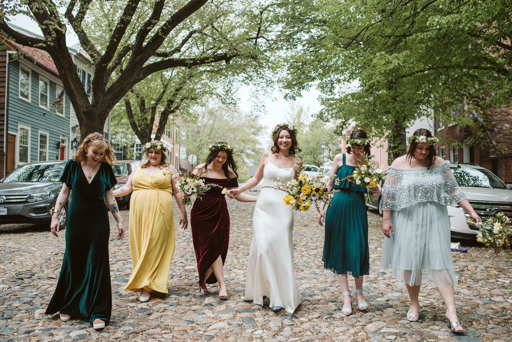  Washington DC, Baltimore Wedding Photographer, Alexandria, Old Town, Jewel Tone, Romantic, Modern, Bride and bridesmaids walking together on cobblestone street, Mismatched bridesmaid dresses, Sungold Flower Co 