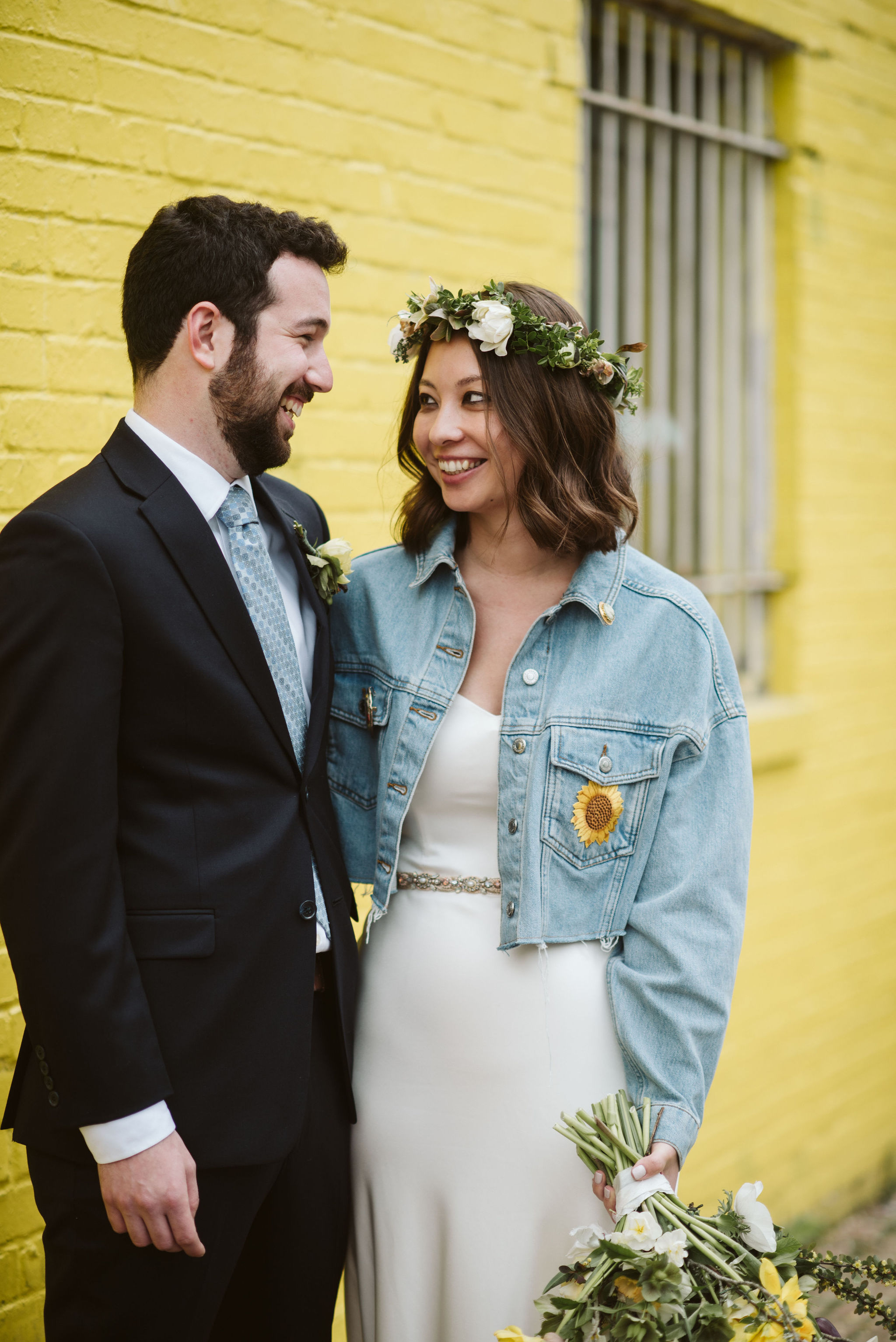  Washington DC, Baltimore Wedding Photographer, Alexandria, Old Town, Jewel Tone, Romantic, Modern, Sweet photo of bride and groom smiling together in front of yellow wall 