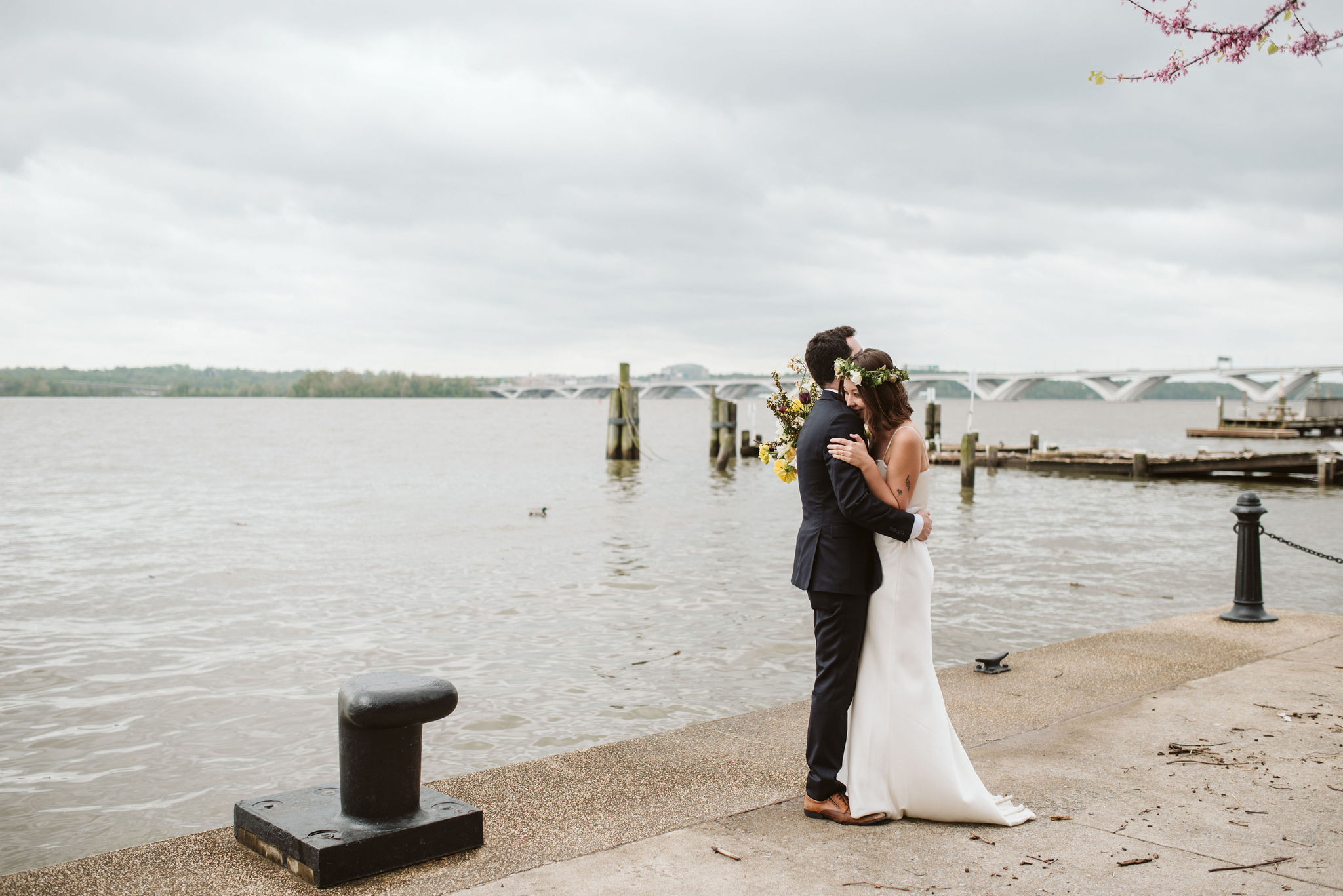  Washington DC, Baltimore Wedding Photographer, Alexandria, Old Town, Jewel Tone, Romantic, Modern, Bride and Groom Hugging in Front of Waterfront, Flower crown, Sungold Flower Co 