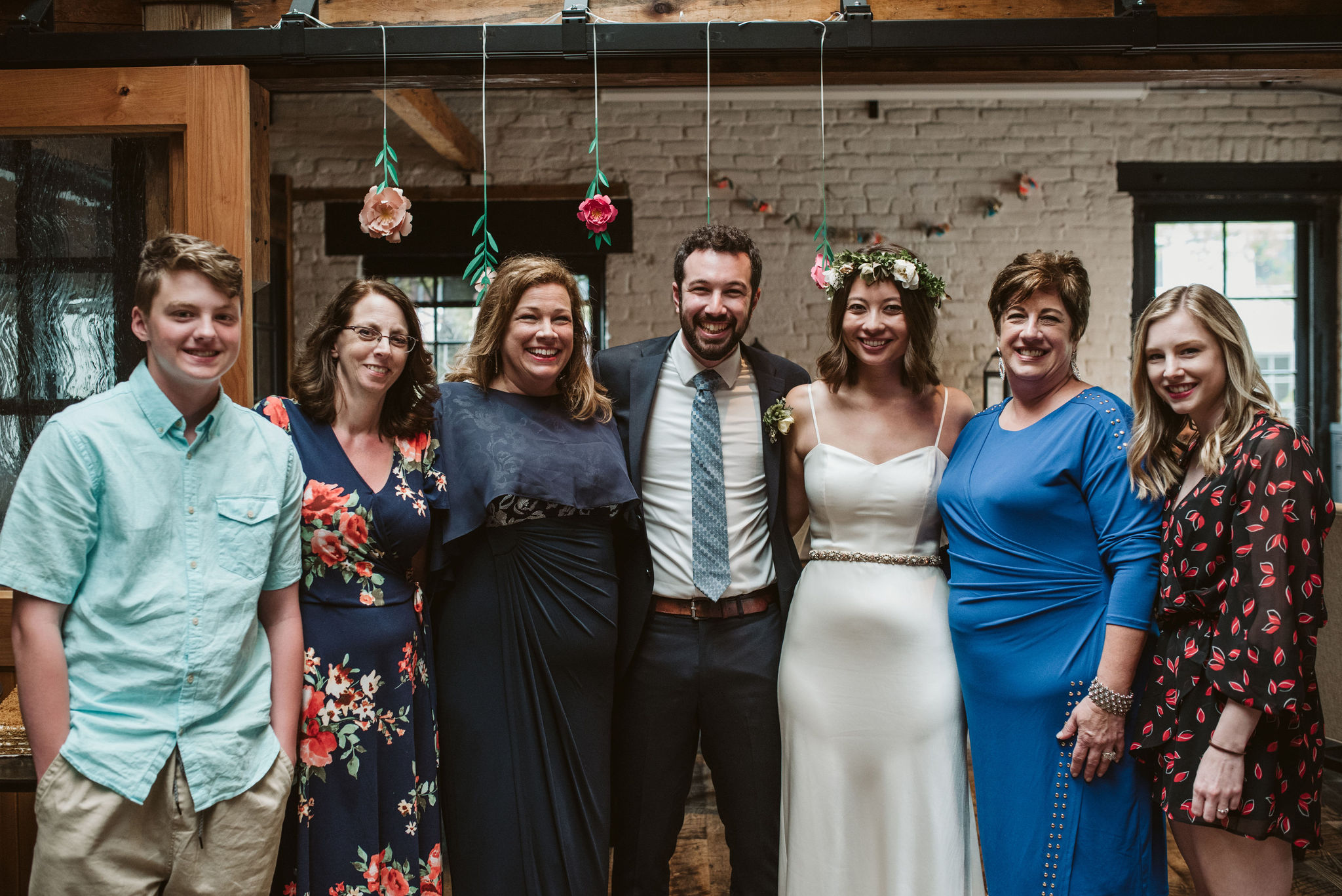  Washington DC, Baltimore Wedding Photographer, Alexandria, Old Town, Jewel Tone, Romantic, Modern, Virtue Feed &amp; Grain, Portrait of Bride and Groom with Family Under Paper Flowers 