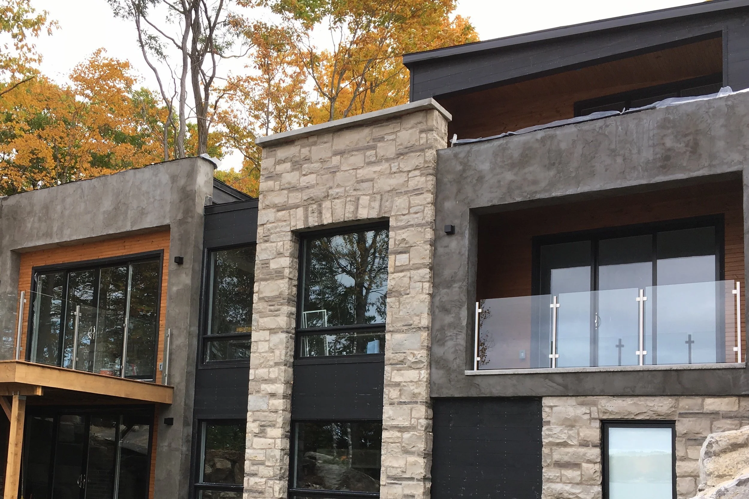  Stainless posts and stainless glass clips, 10mm clear glass exterior guard rail. Modern Cottage, Stoney Lake 