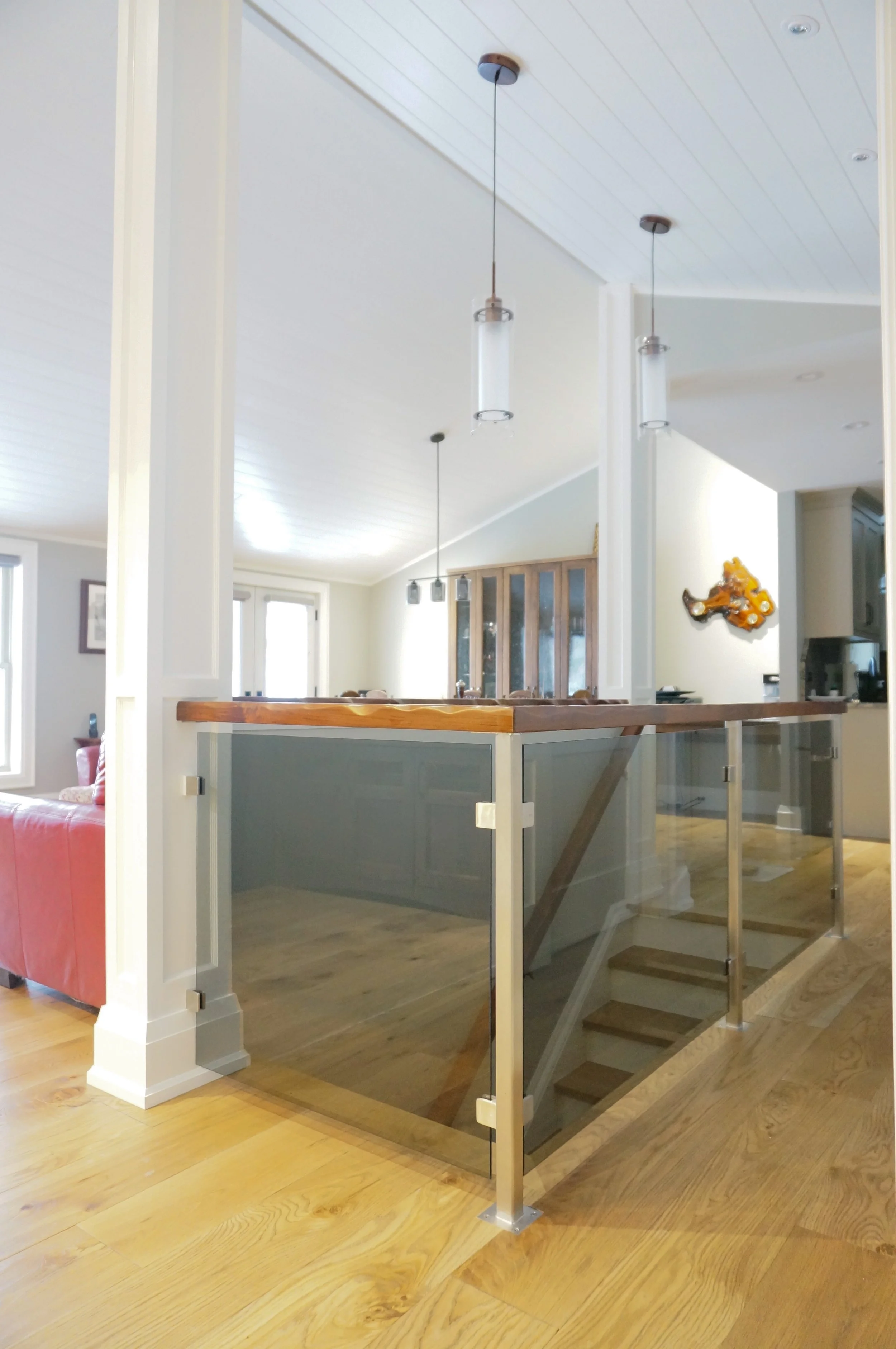  Interior glass stair railing with stainless post and wood top rail, stainless hardware. Boshkung lake 