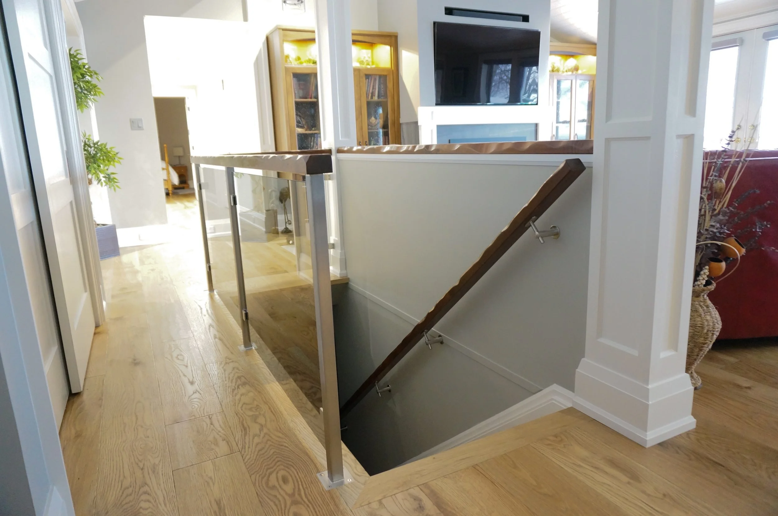  Tempered glass stair railing with stainless post and wood top rail, wall mounted wood handrail,  Haliburton county 