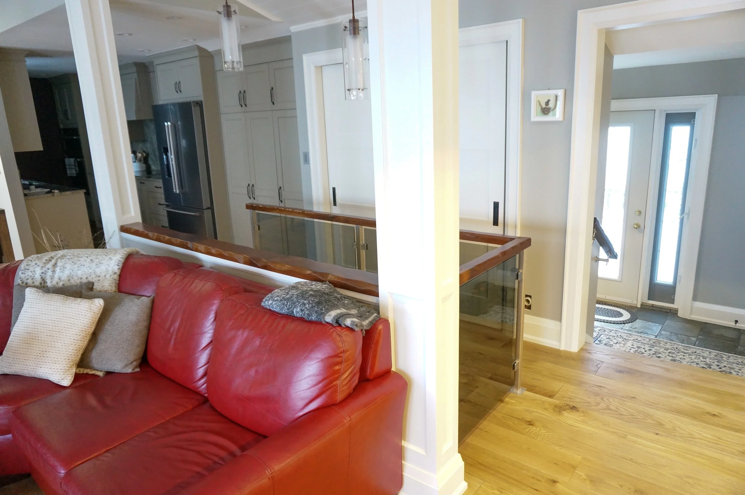  Grey glass railing with stainless post and wood top rail and handrail, Cottage in Haliburton county  