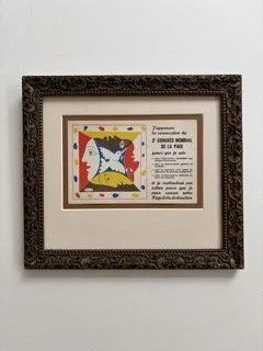 A vintage postcard with art made by Picasso, with antique frame