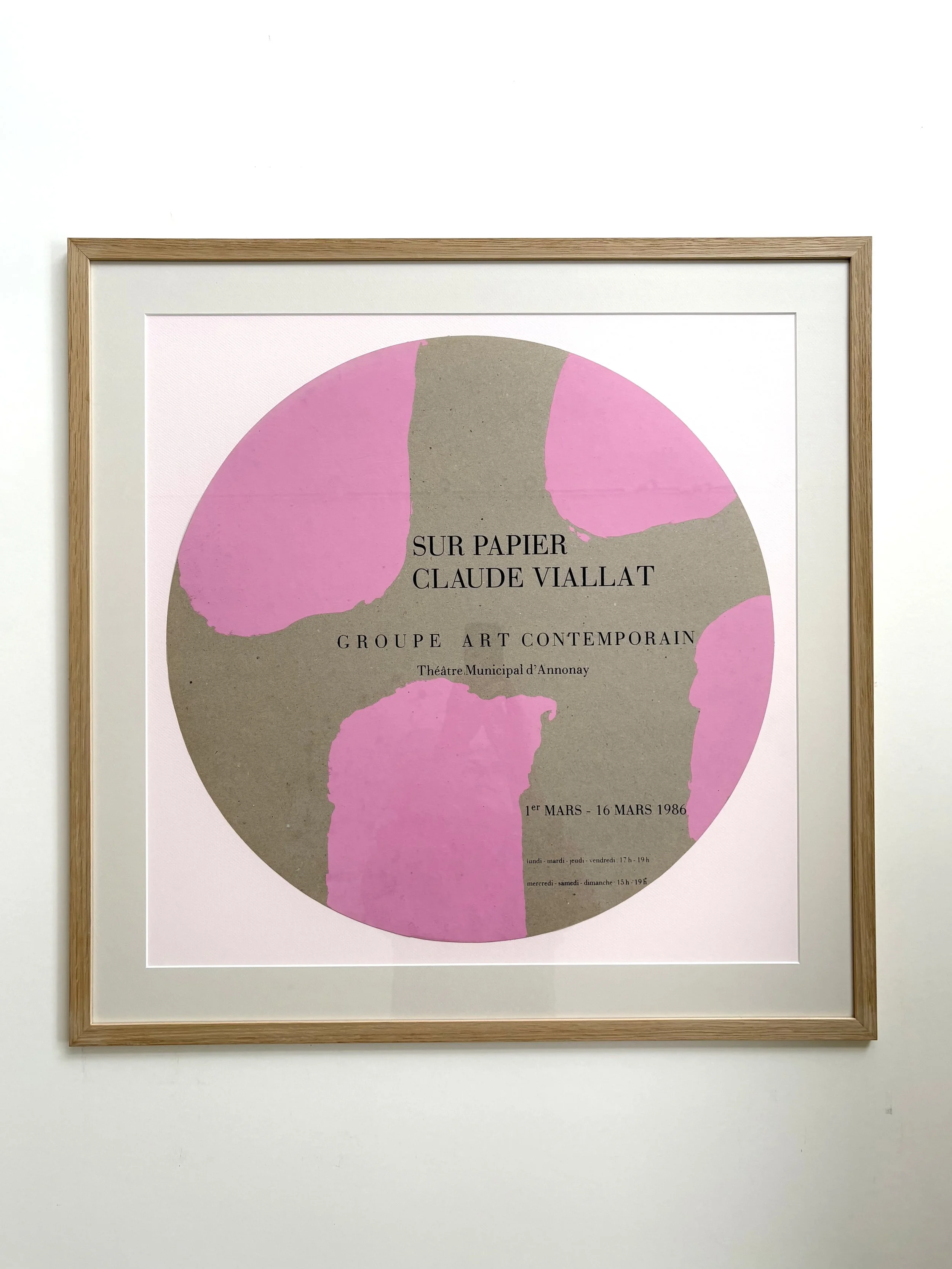 A round silkscreen poster with art done by Claude Viallat, with oak frame
