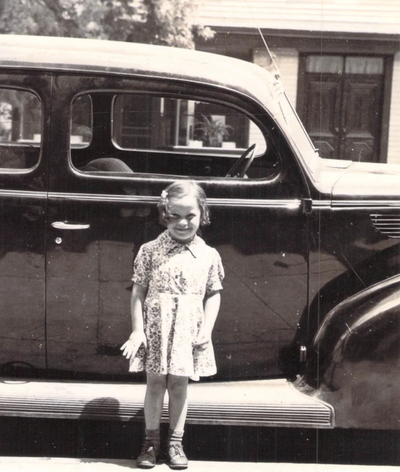 In front of her father's store.