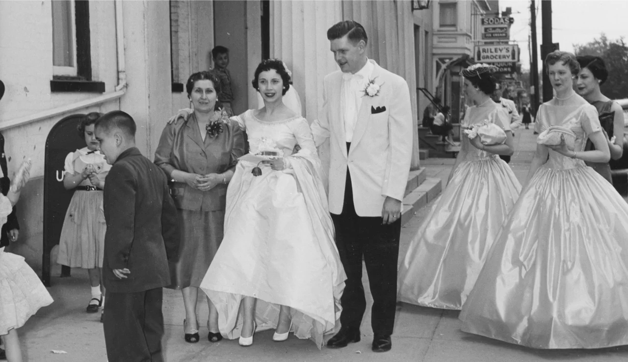 Mom and Dad on their wedding day with her mother, Anna Borrelle. In the background is the General Worth Hotel, which was just a few steps from where my mother grew up. 