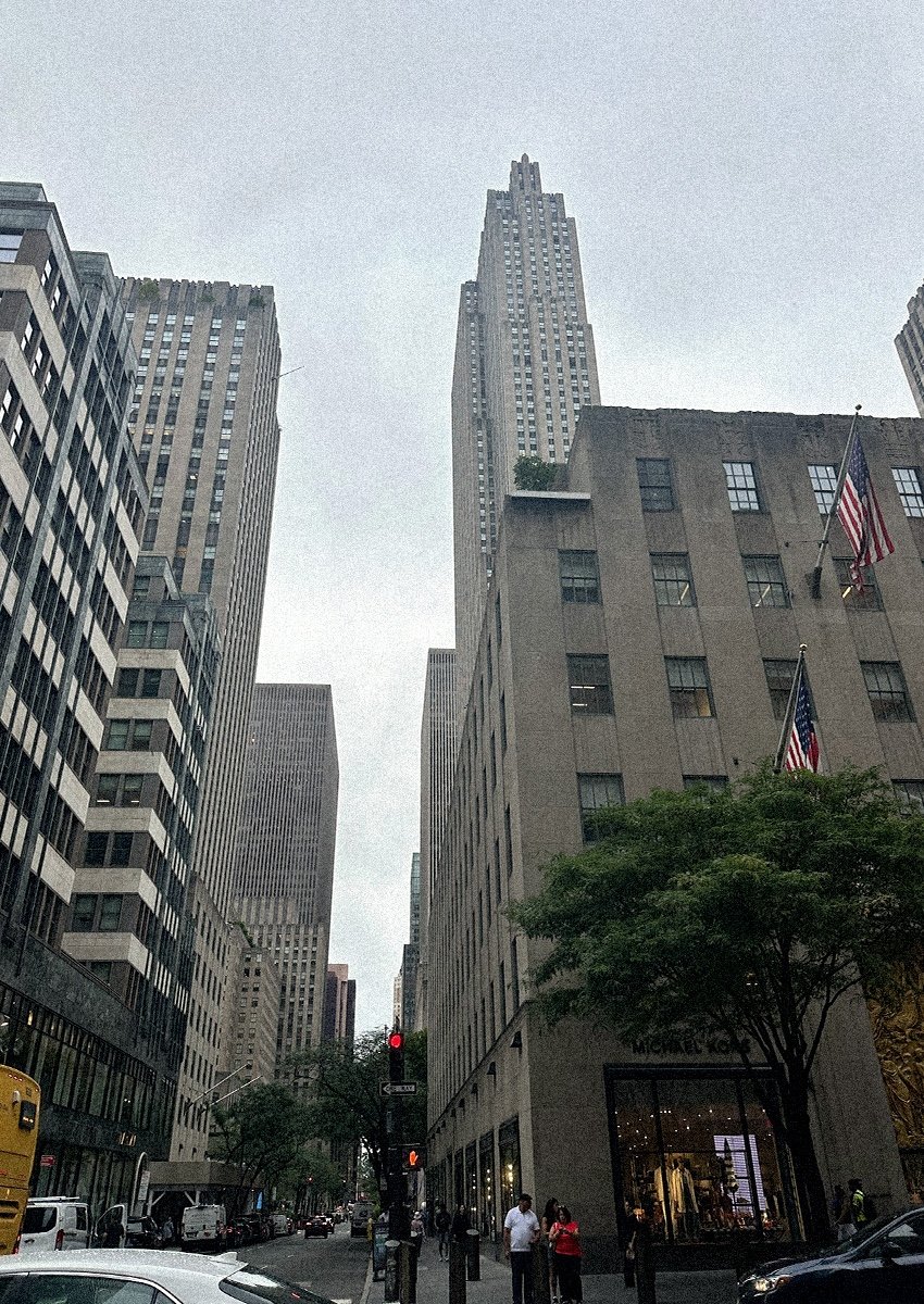 Rows of tall buidlings and skyscrapers along a city street