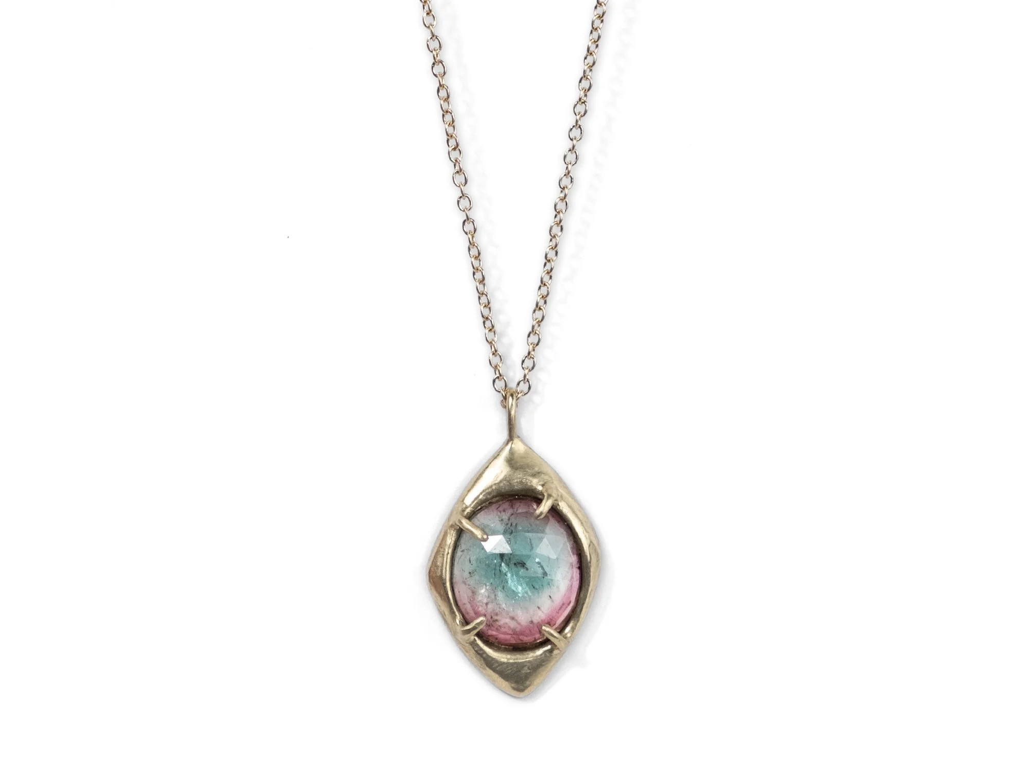 Heavy gold pendant necklace with a tourmaline stone in the center