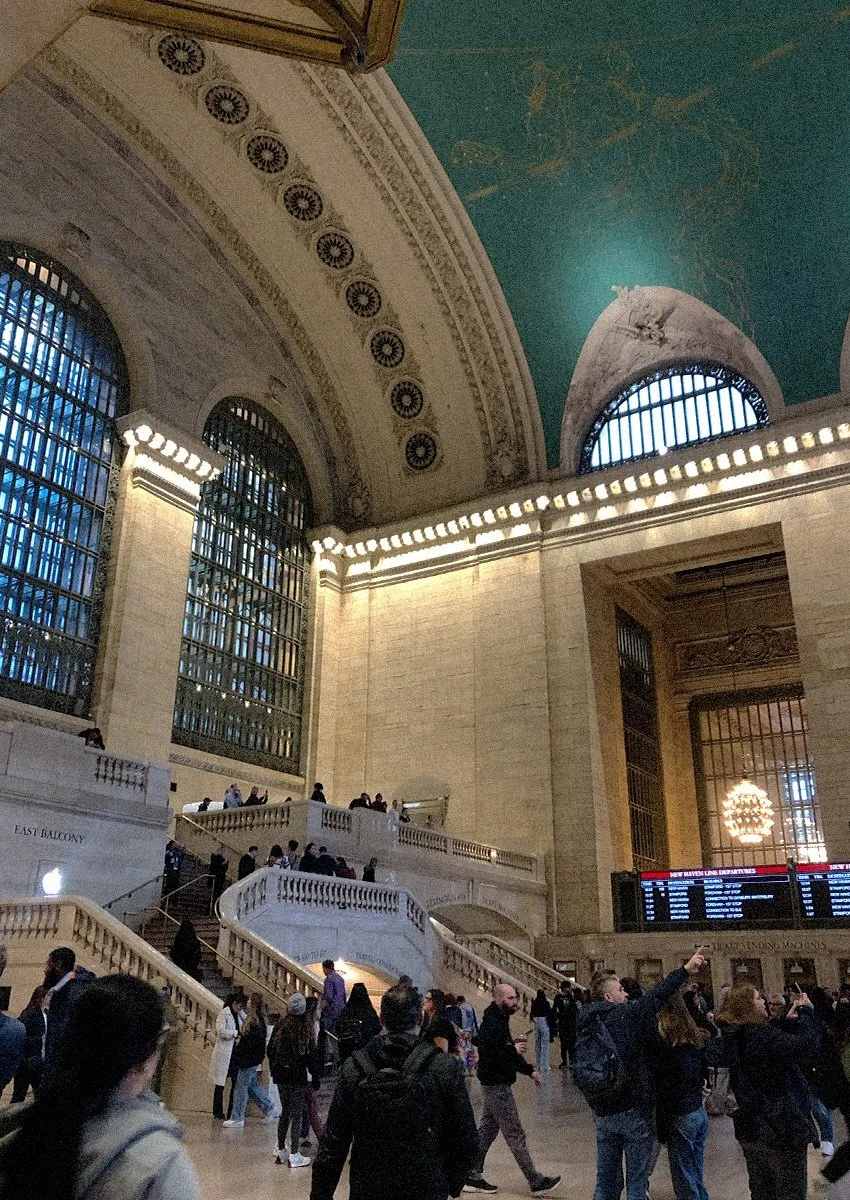 Inside a large train station hall