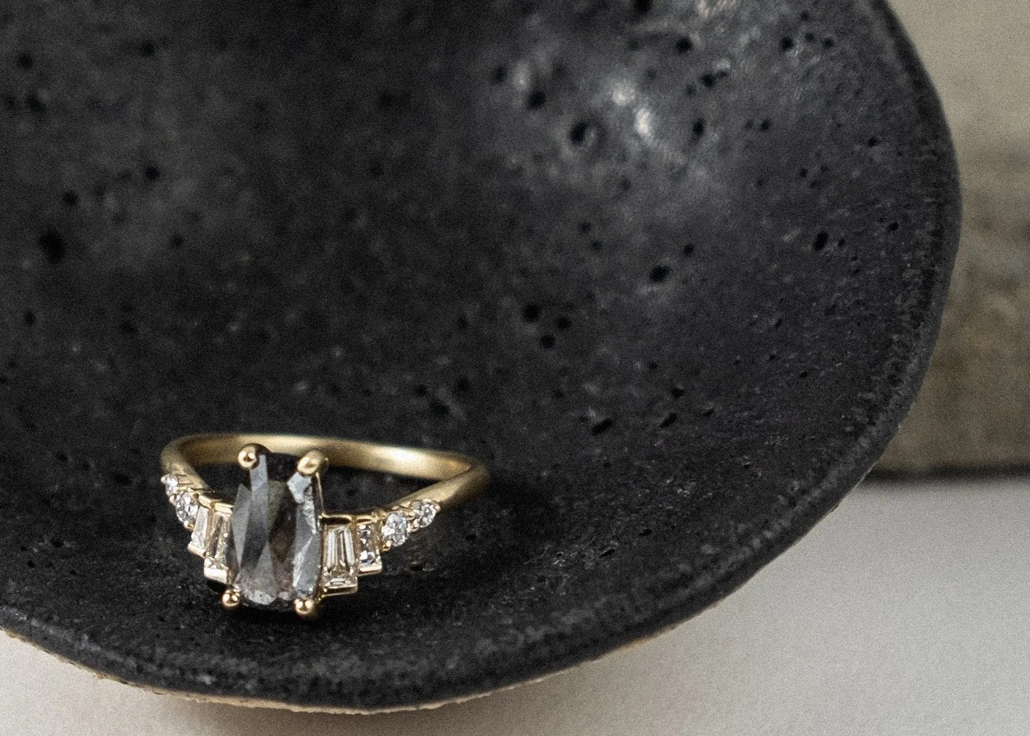 A gray and white diamond engagement ring