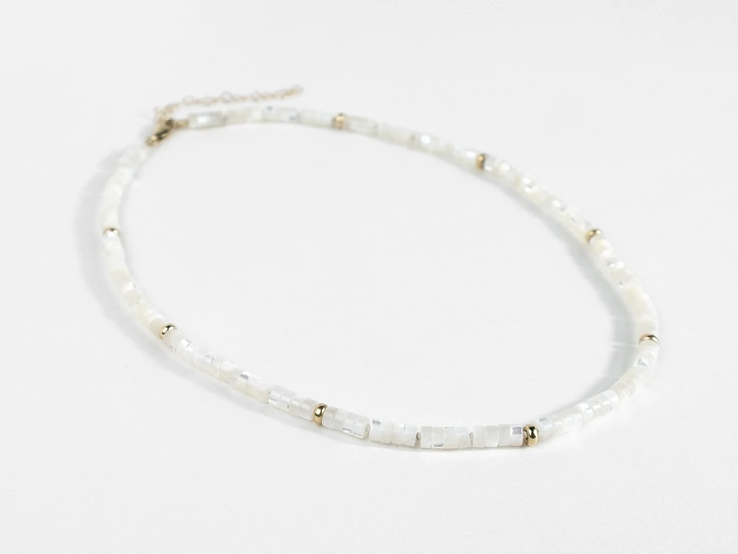 Mother of pearl and gold bead necklace