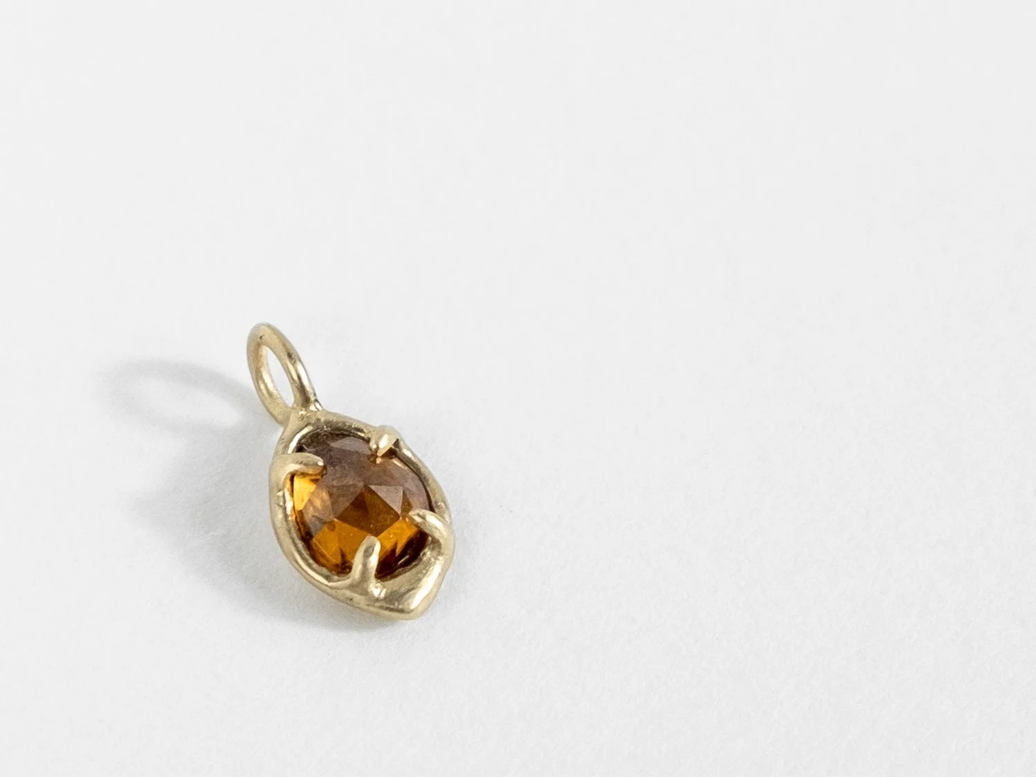14k gold and deep golden zircon charm