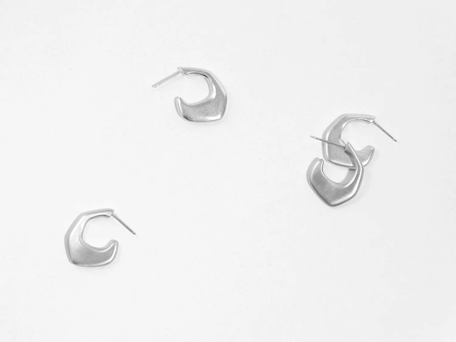 Organically-shaped huggie-style earrings in sterling silver