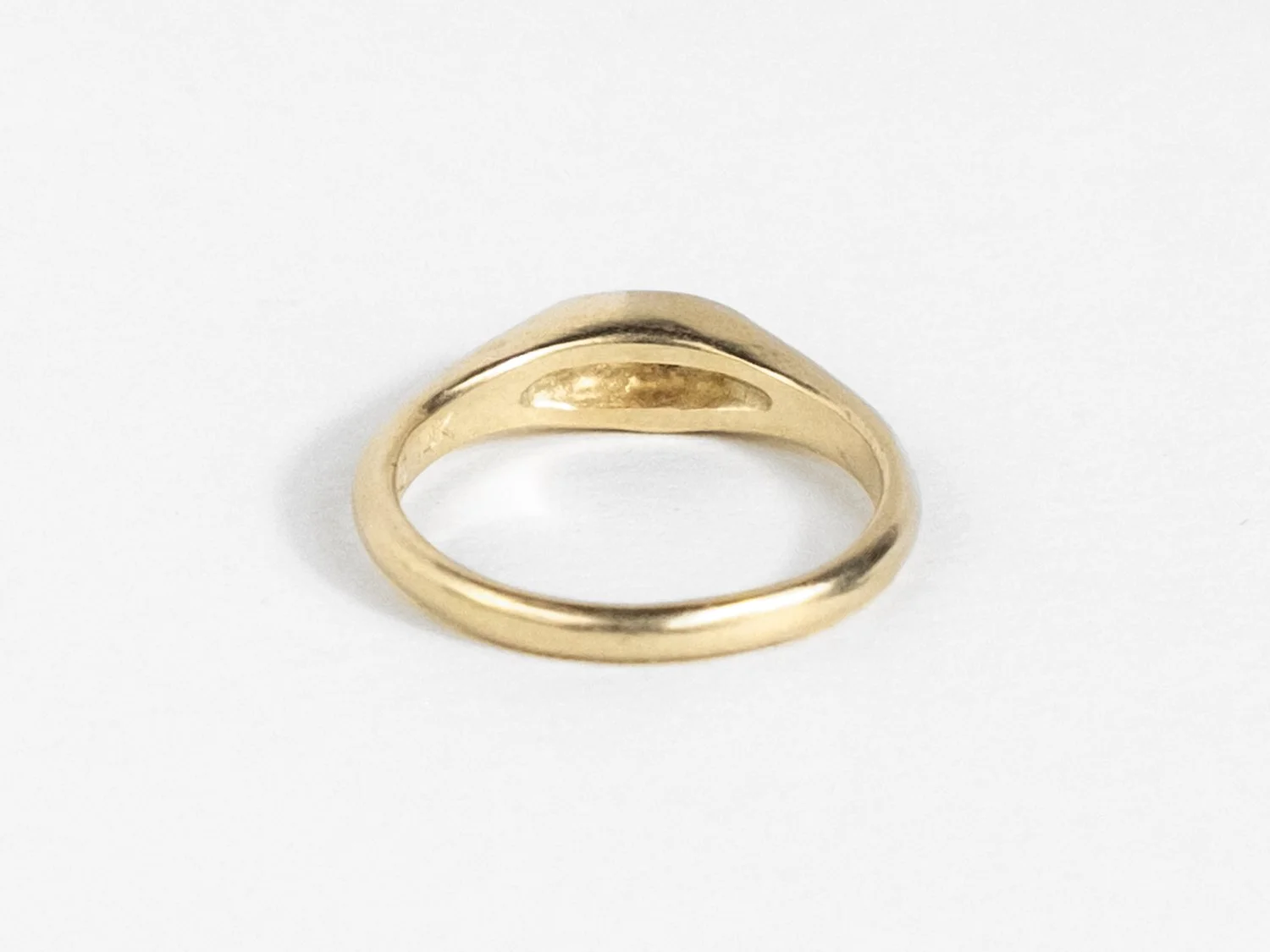 Back view of a slim gold signet ring (Copy)