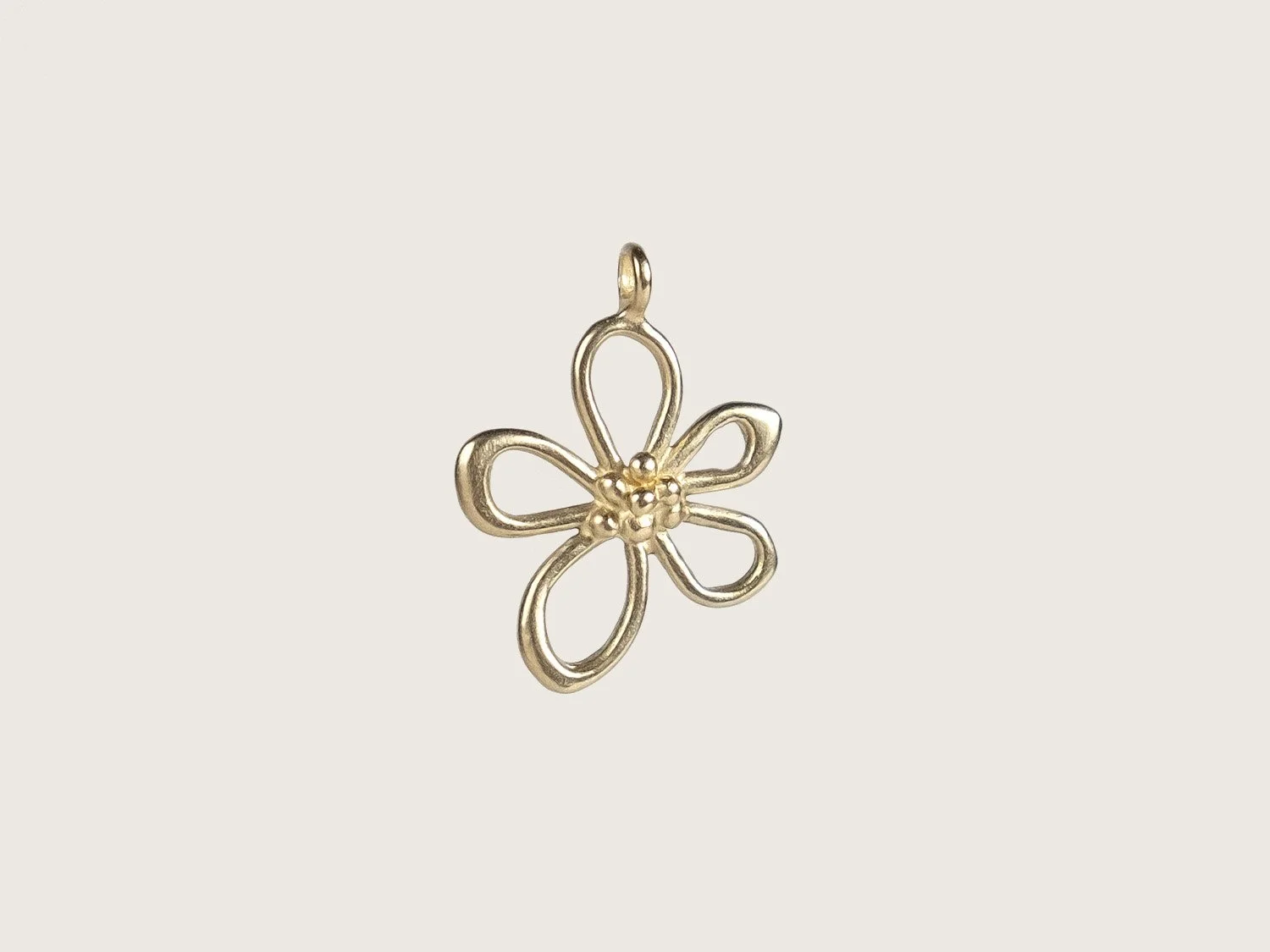 Gold flower-shaped charm