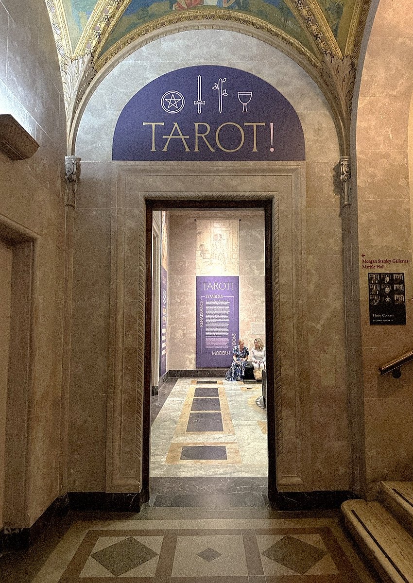 An open doorway with a sign above it that reads, "Tarot!"