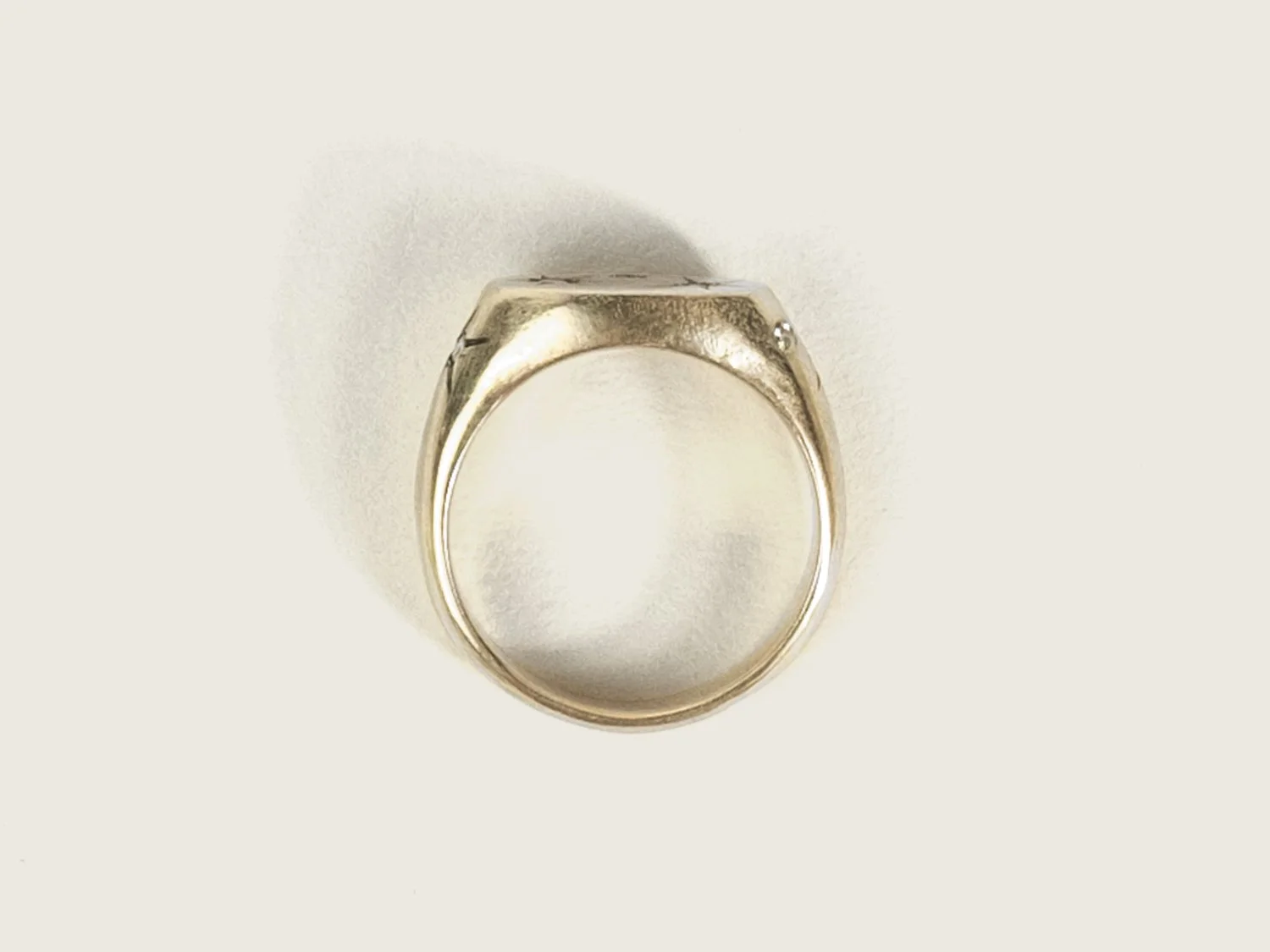 Overhead view of a wide gold signet ring