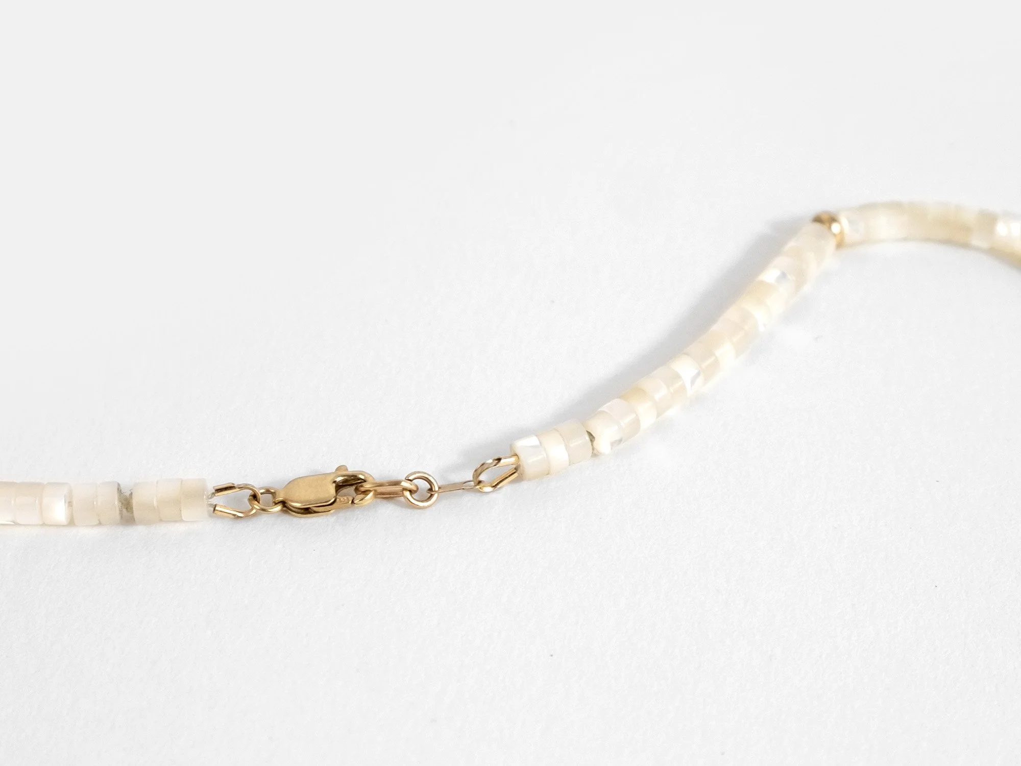 Necklace with mother-of-pearl and gold beads by Sara Golden Jewelry