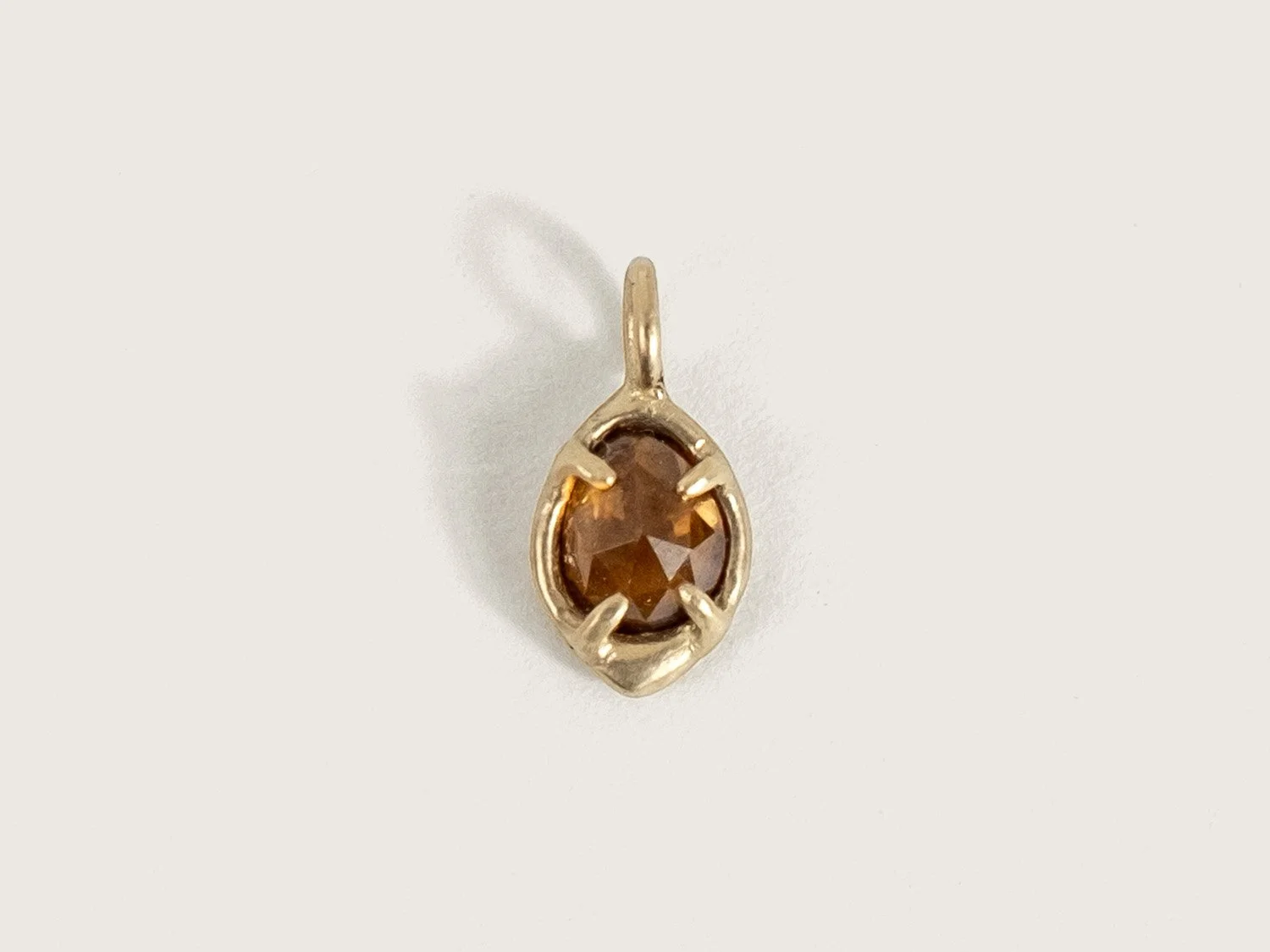 14k gold and deep golden zircon charm