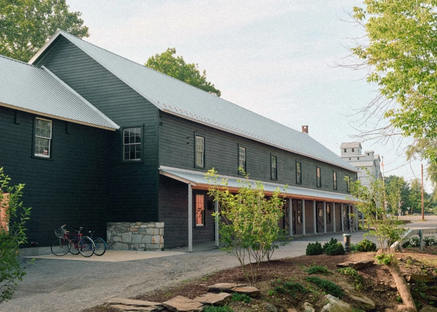 Dark gray building with bikes out front