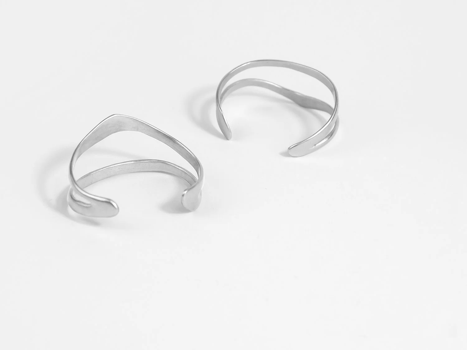 Back view of organic, wavy cuffs in sterling silver by Sara Golden Jewelry