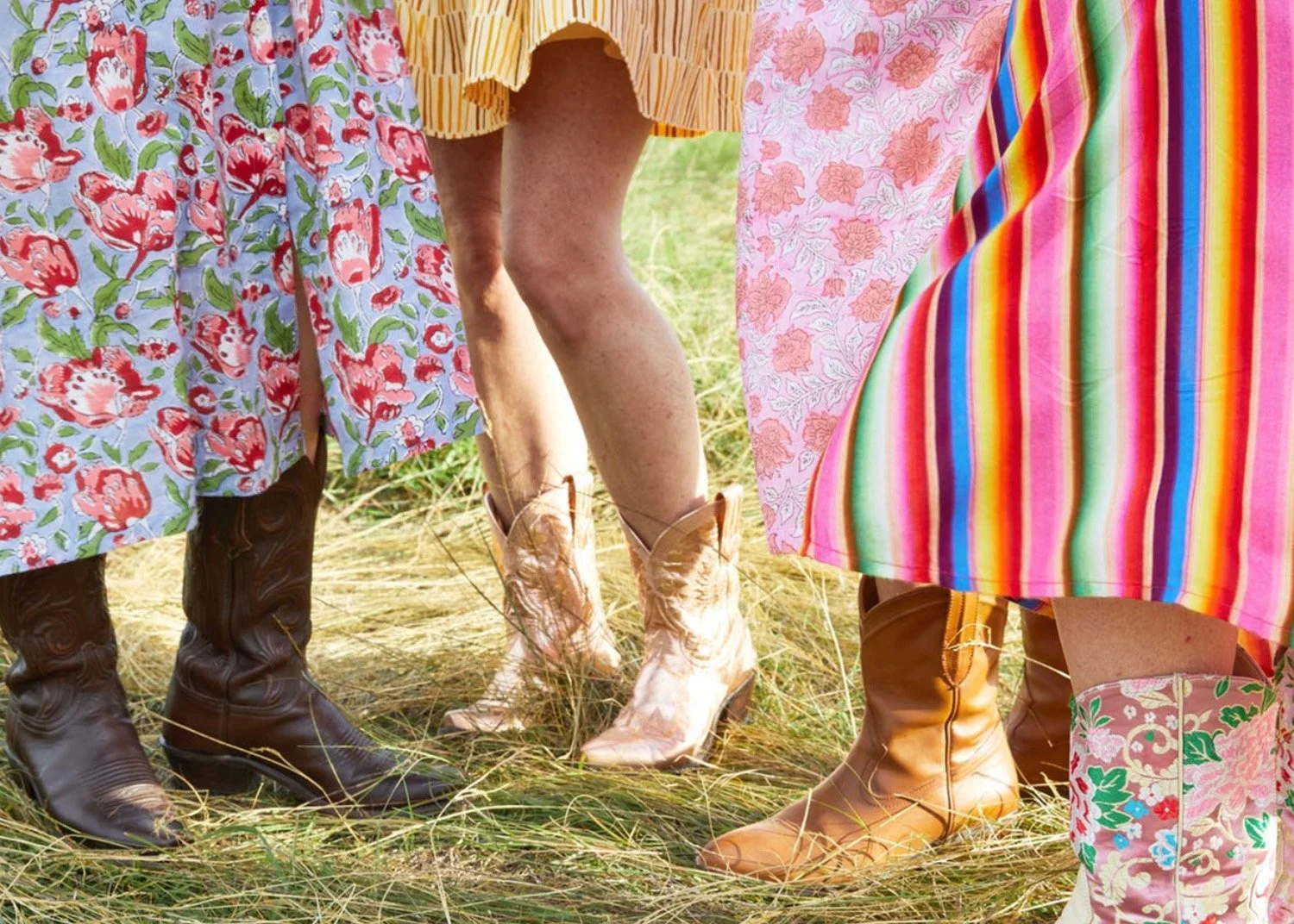 Close up of four women wearing skirts and cowboy boots