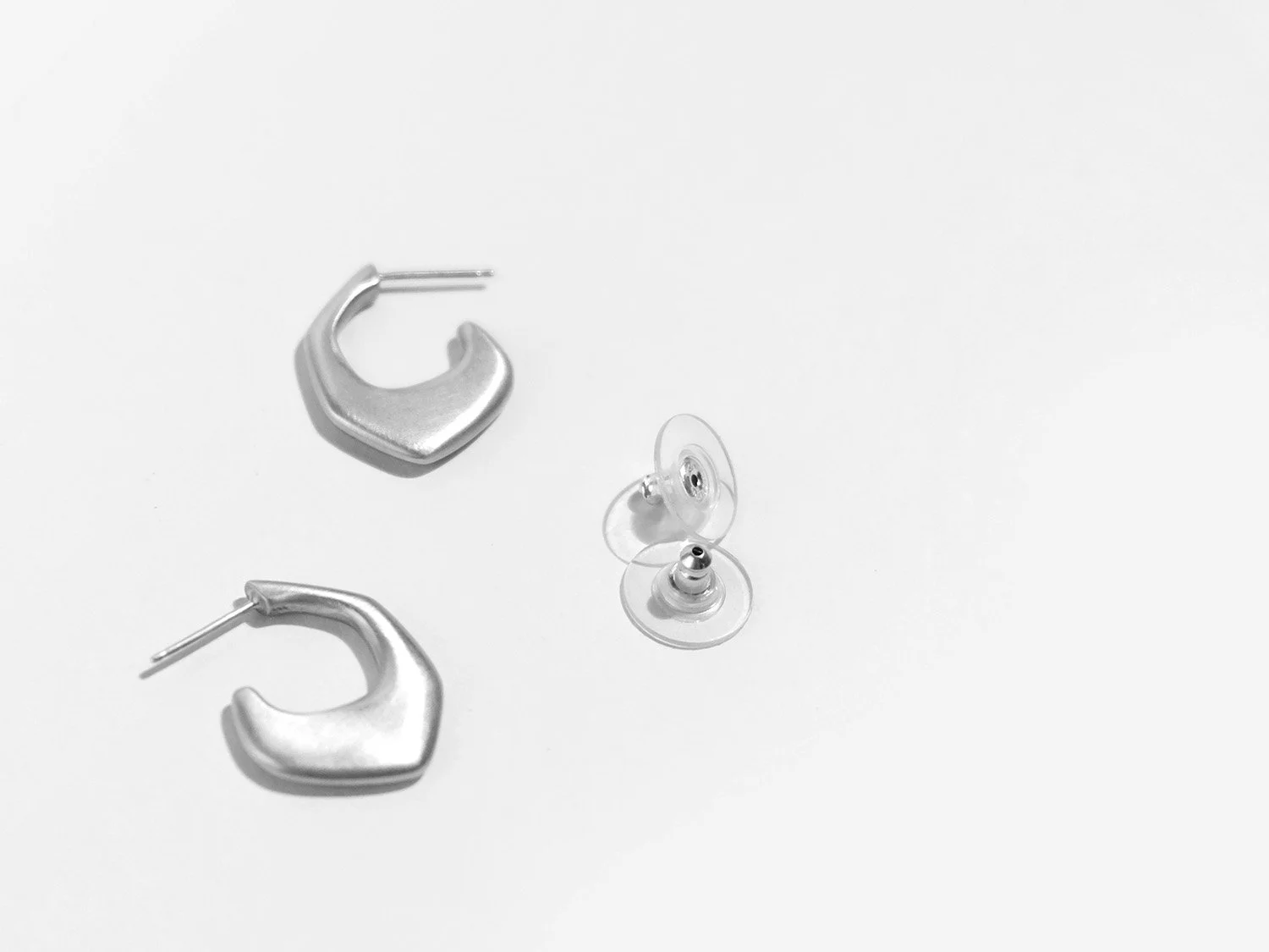 Organically-shaped huggie-style earrings in sterling silver