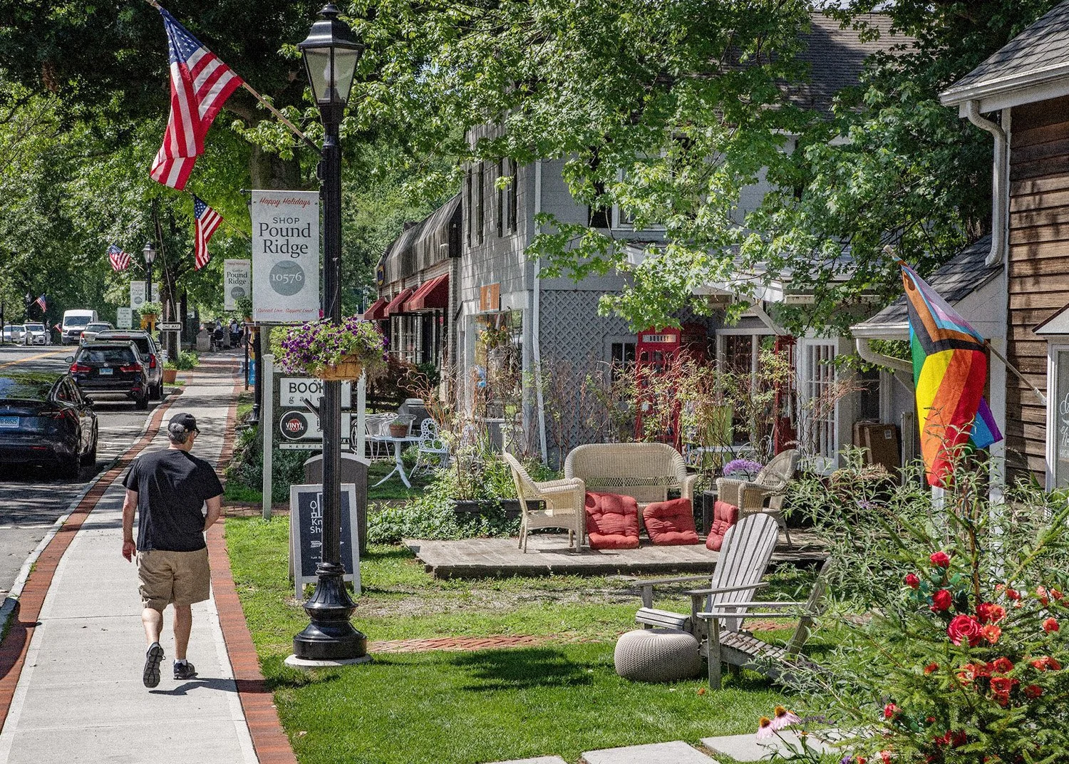 Man walking down a small town's main street