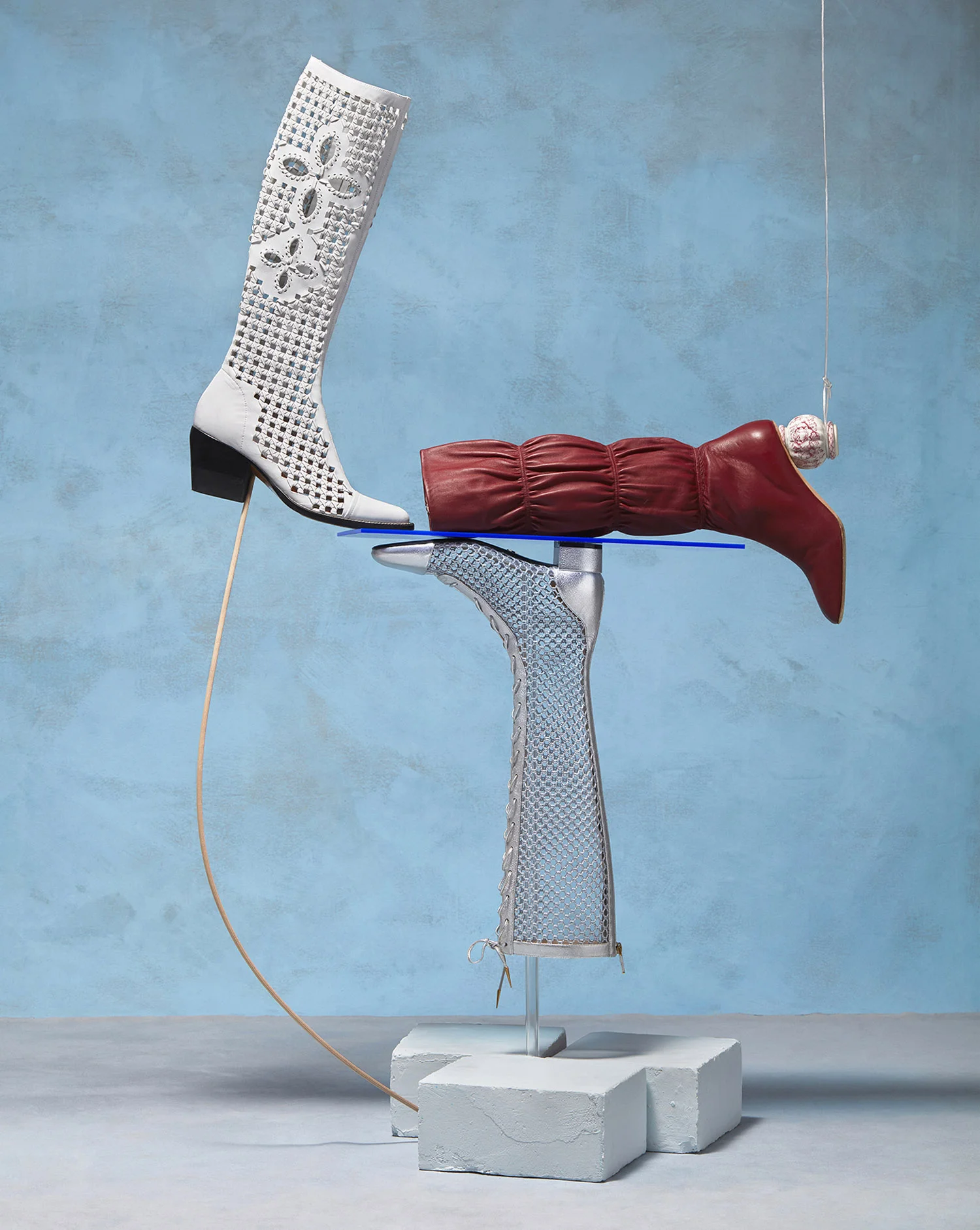 Sunday Times set design still life of knee high boots