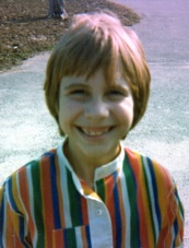 Me, age eight, rocking my groovy rainbow-striped shirt.