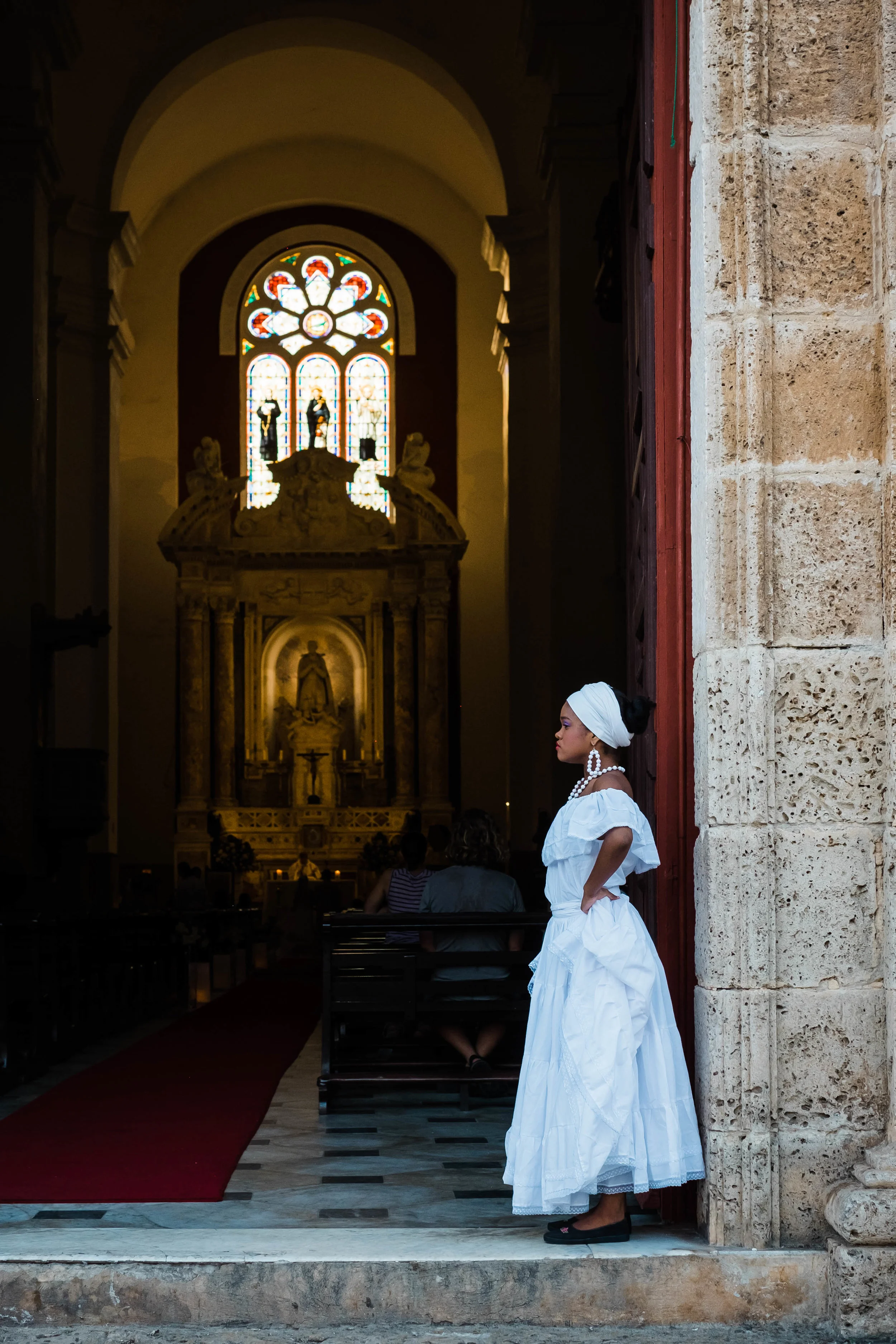 Wedding dancer waiting for her performance at a church in El Centro, Cartagena, Colombia.