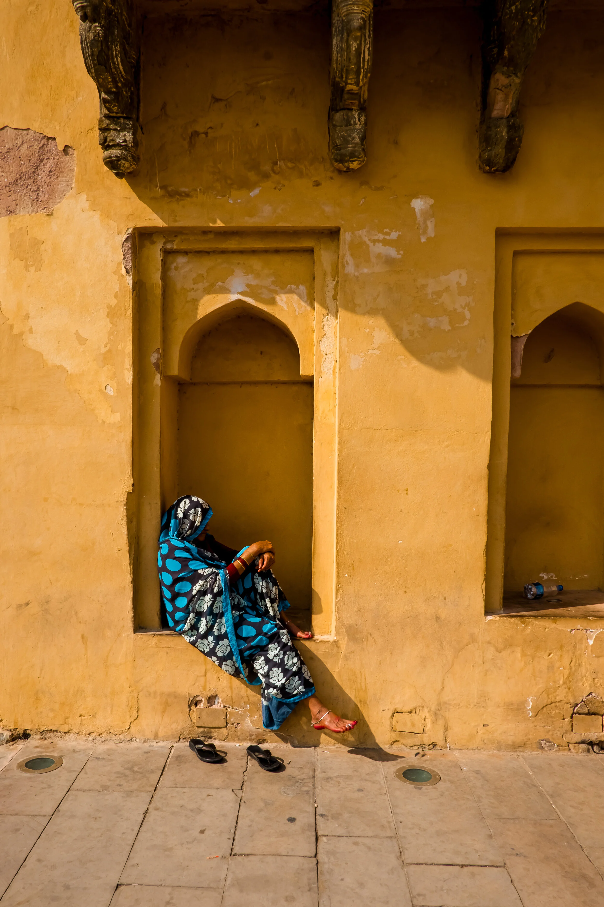 A woman takes a break at Amer Fort in Jaipur, India.