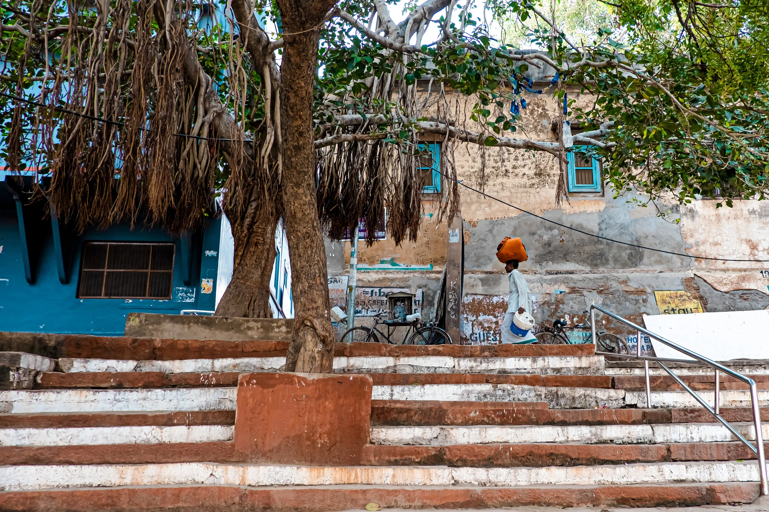 Man with a load on his head in Varanasi. India.