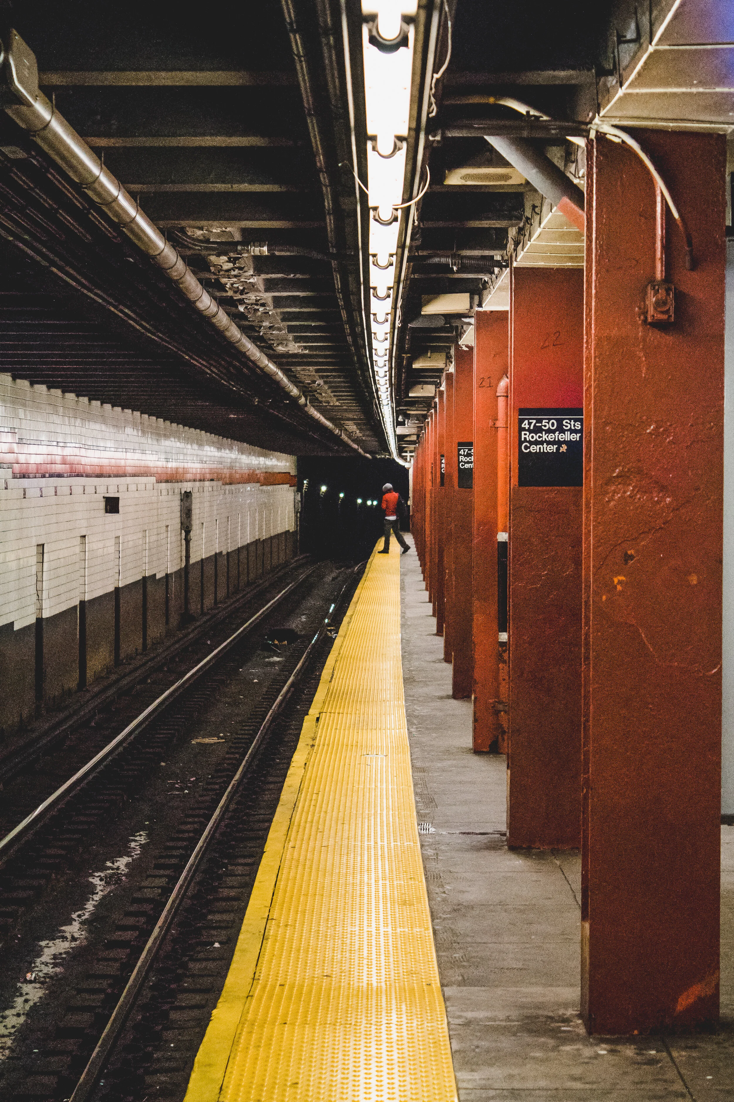 A man checking the arrival of a subway in New York, USA.
