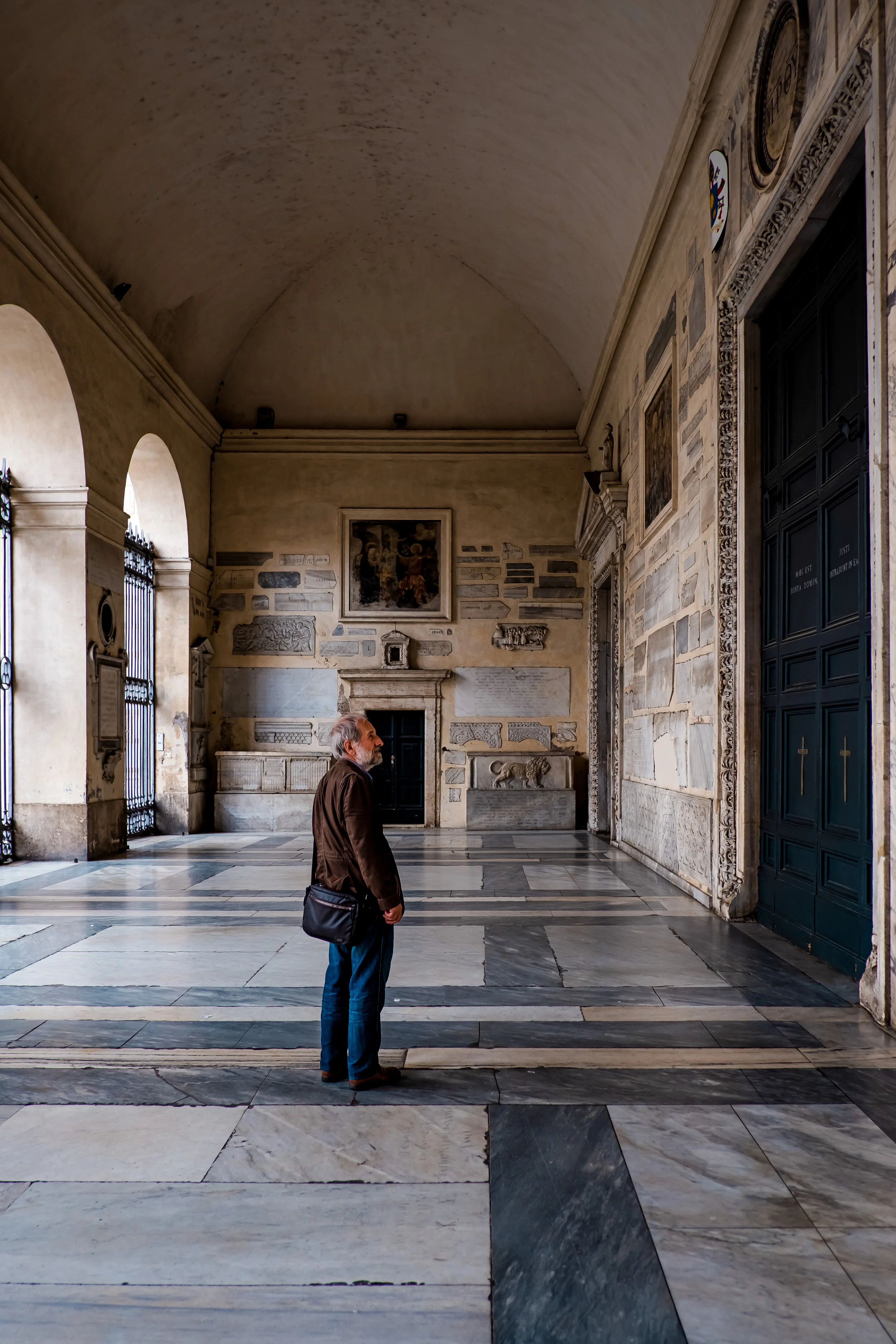 A visitor at Basilica of Our Lady in Trastevere, Rome, Italy.