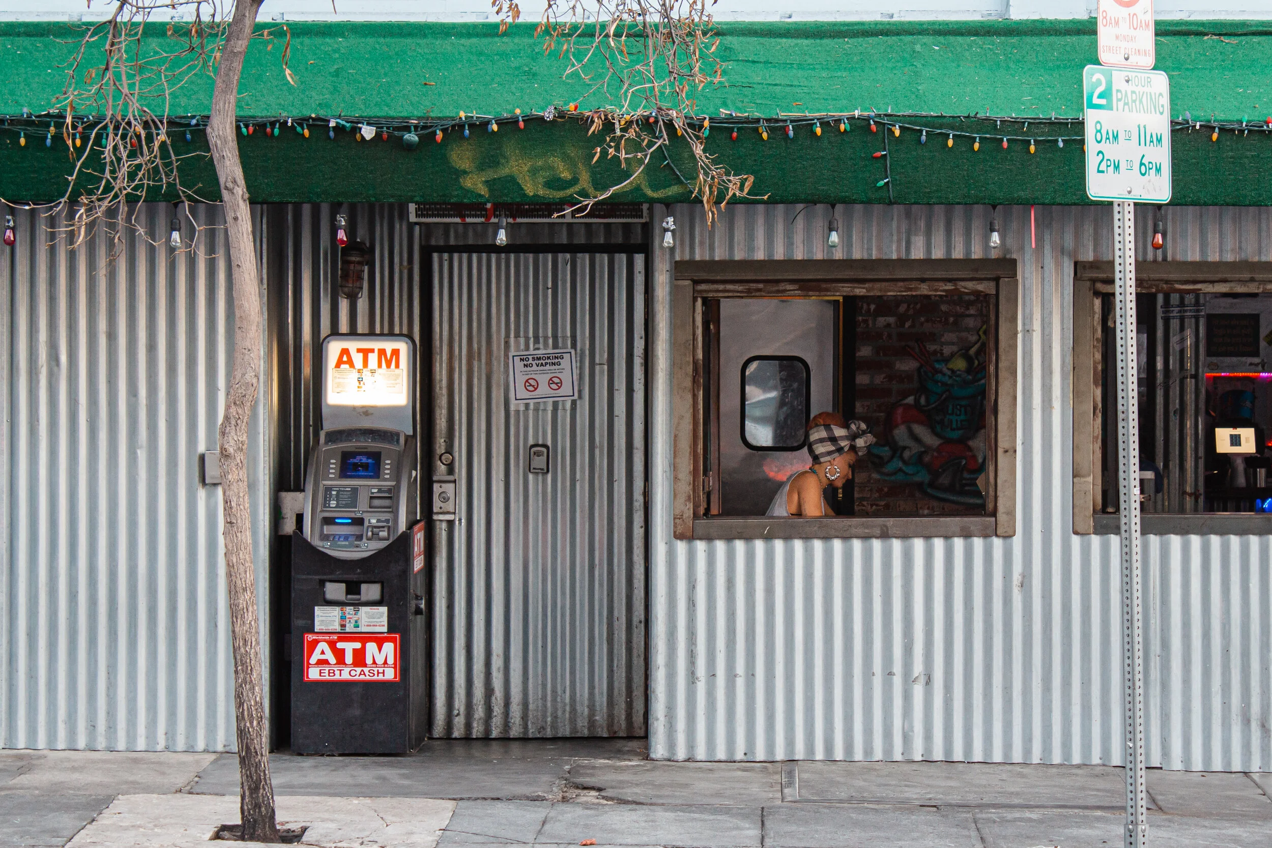 Woman sits in a bar in Los Angeles, CA, USA.
