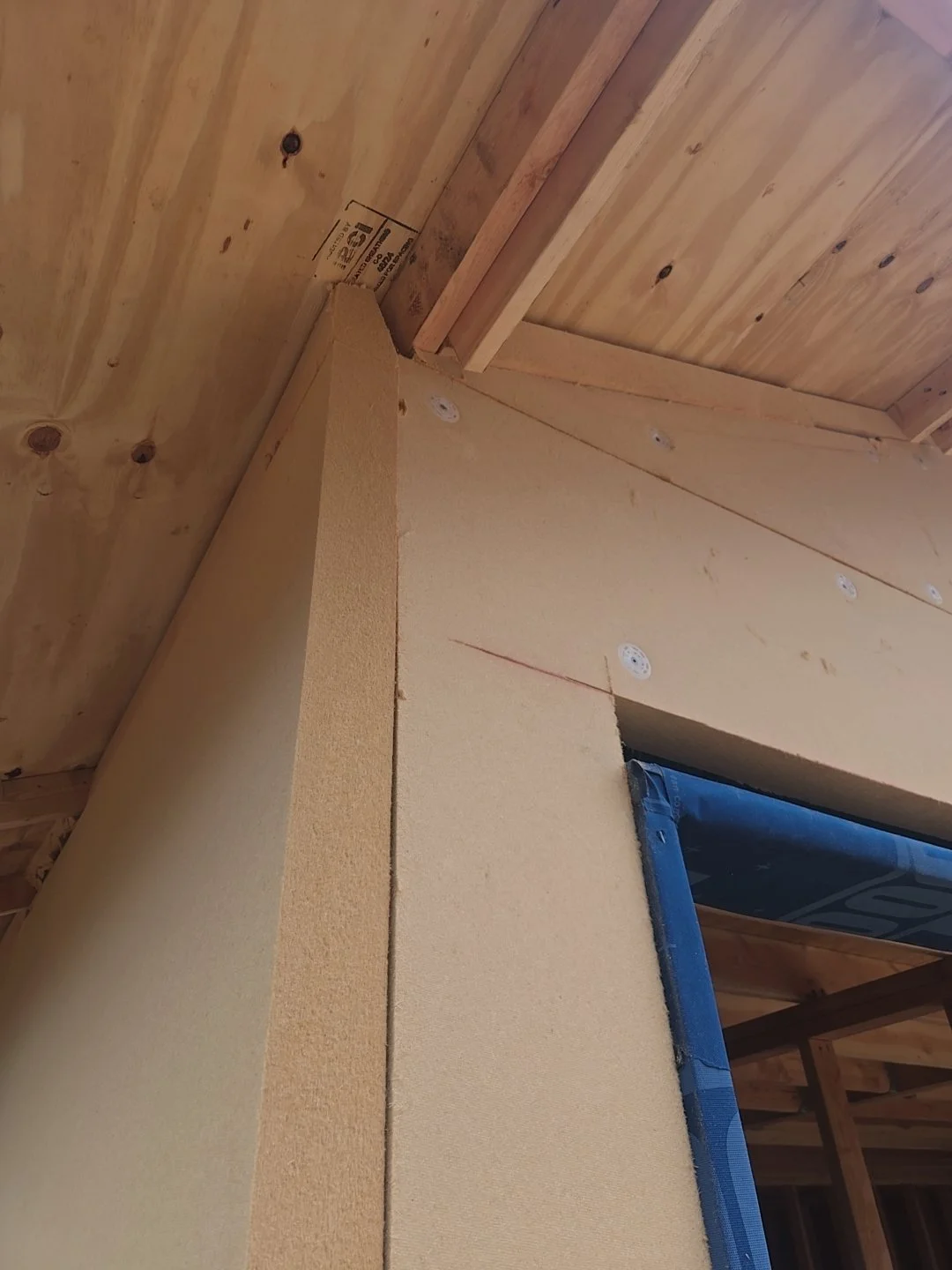 Close-up of exterior wall insulation board installed as part of the enclosure system.