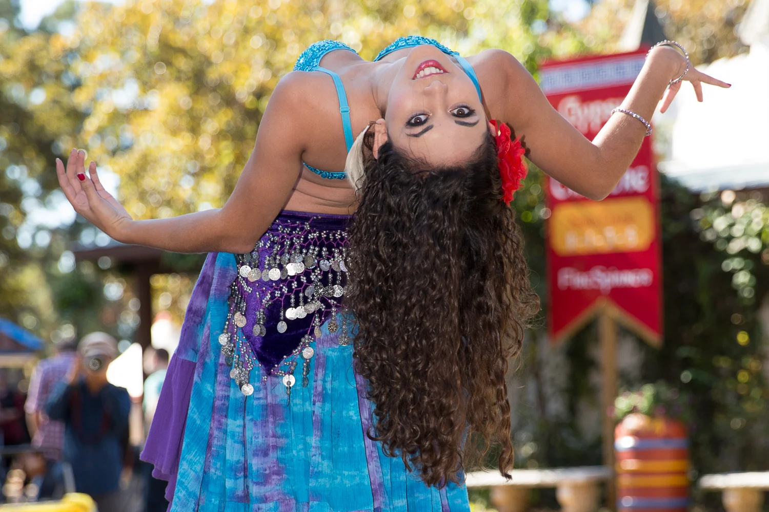 Beautiful belly dancer bending over backward at the Texas Renaissance Festival