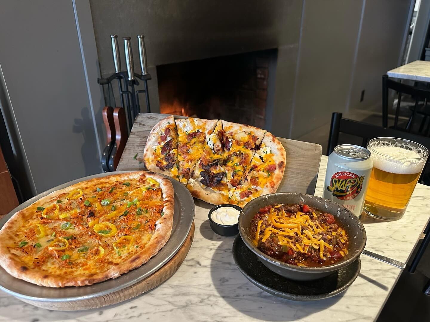 Super Bowl specials are here and at the risk of sounding like a total nerd, they are a TOUCHDOWN! Buffalo Chicken Pizza with T&rsquo;s homemade buffalo sauce. Loaded Baked Potato Flatbread. Best Damn Chili. Call in and order or order online https://o