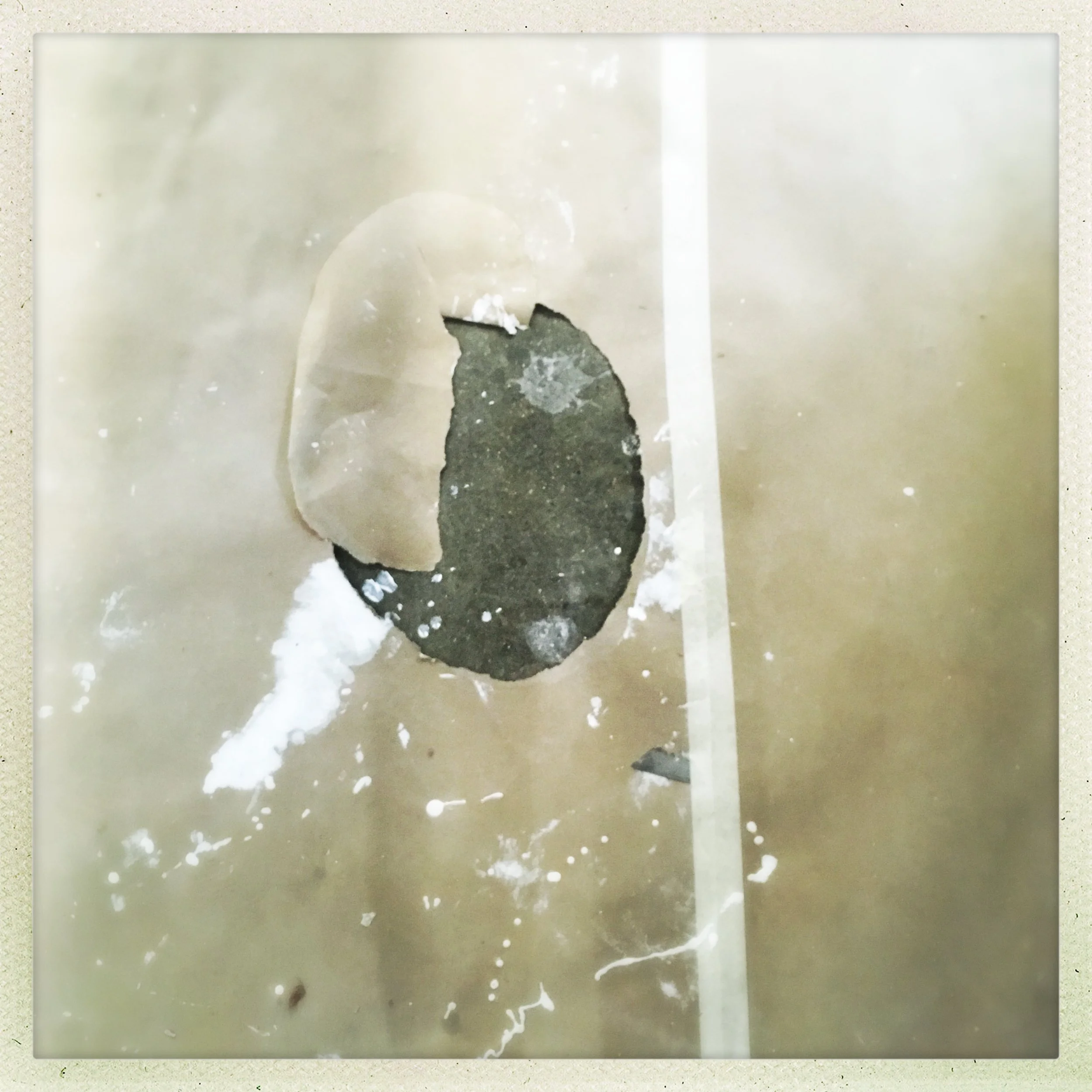 a floor masked off from paint at the printmaking studio.