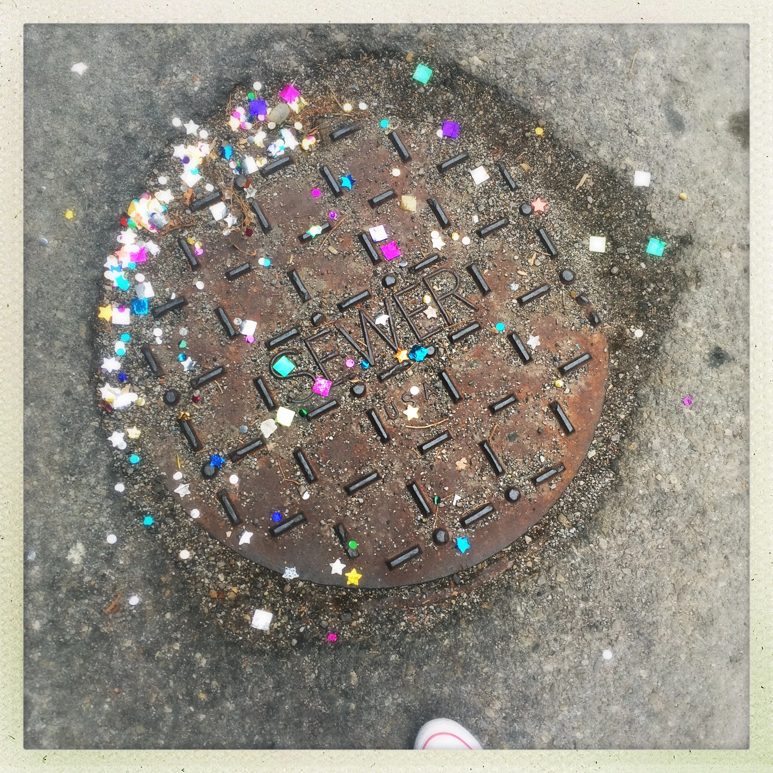 cast in a fit of festivity of some kind. and then very difficult to sweep up. now possibly causing digestive distress to the birds who forage by the dumpster nearby. but very sparkly.