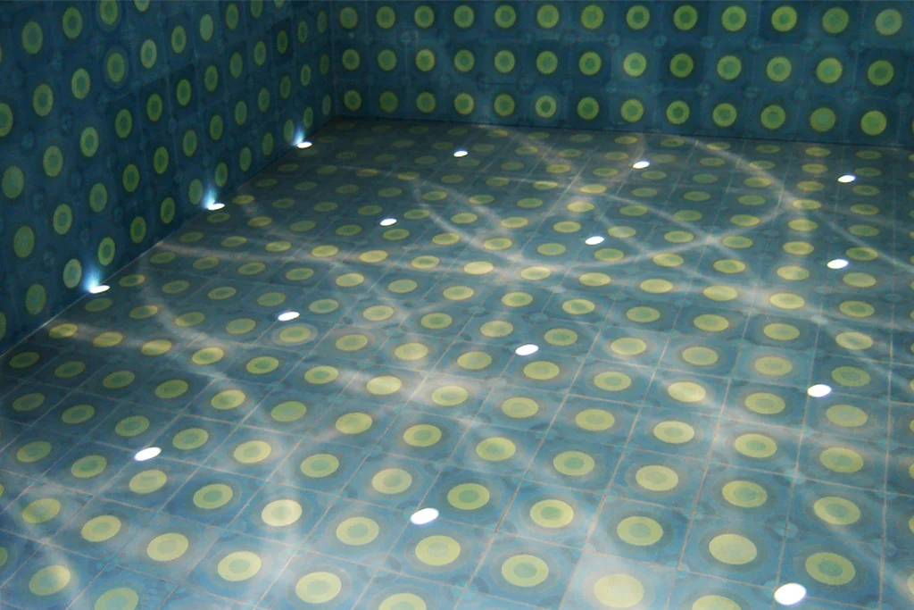 Blue Oasis, San Luis Potosi, Mexico, 2011. Permanent collection Sculpture Park San Luis Potosi. Detail tiled floor with light reflections from wall and ceiling perforations.