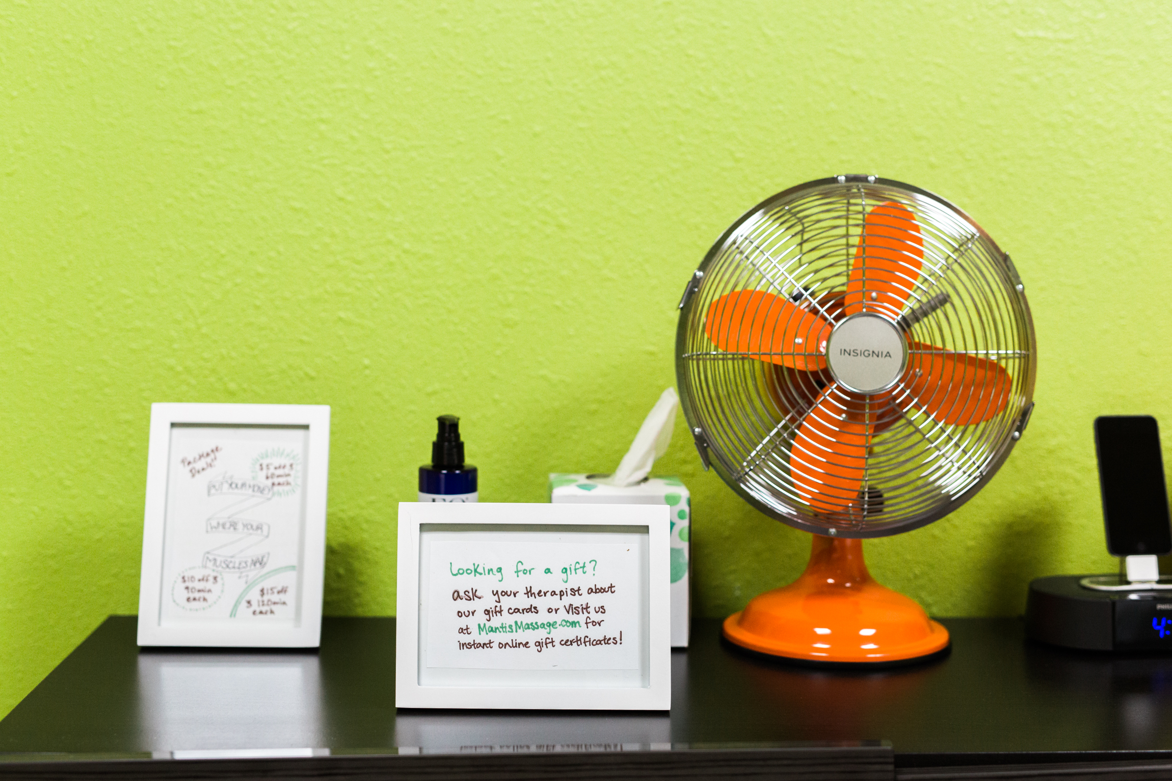  Photo showing a vibrant orange fan at Mantis Massage, located on South Congress Avenue in Austin, Texas. 