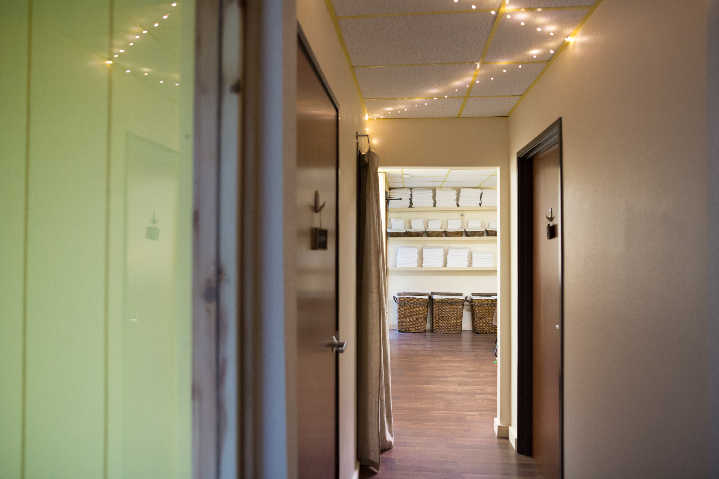  Image of our clean and chic hallway and waiting area at Mantis Massage in Austin, Texas. Adorned with modern décor and bathed in natural light, our inviting space sets the stage for a rejuvenating experience. As you await your personalized massage, 