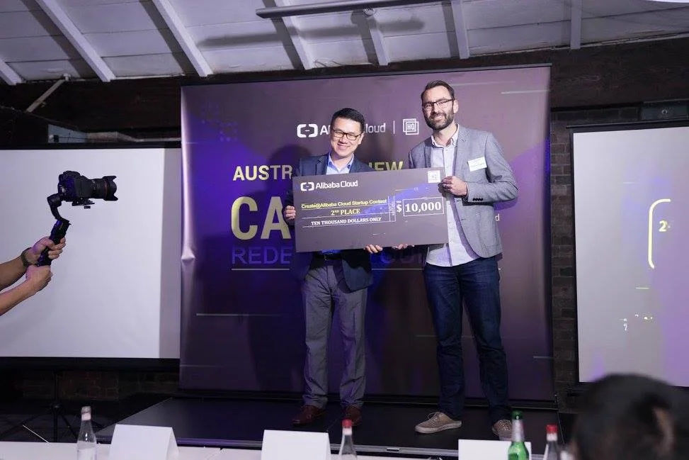 David Haynes of QuestaGame accepting a large novelty cheque upon qualifying for the global final.