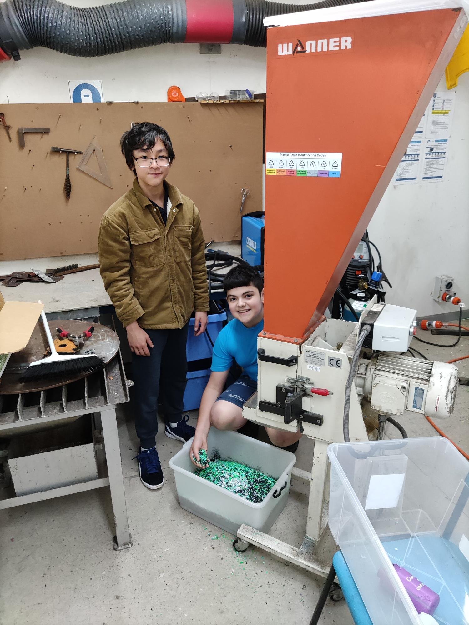 MAP Students recycling plastic for their landscaping project.