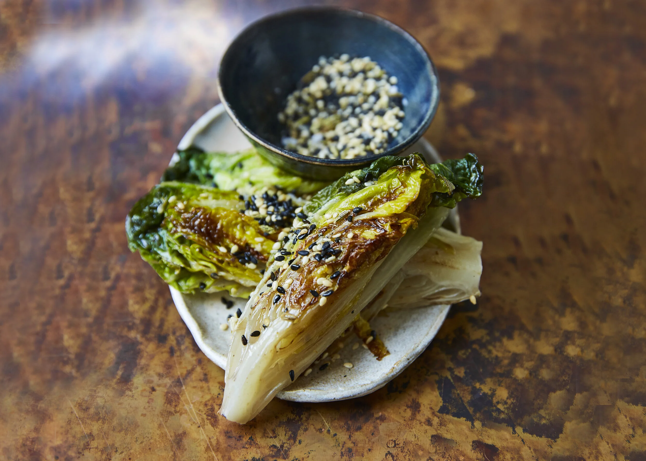 BRAISED GEM LETTUCE WEDGES WITH FENNEL AND SESAME GOMASHIO
