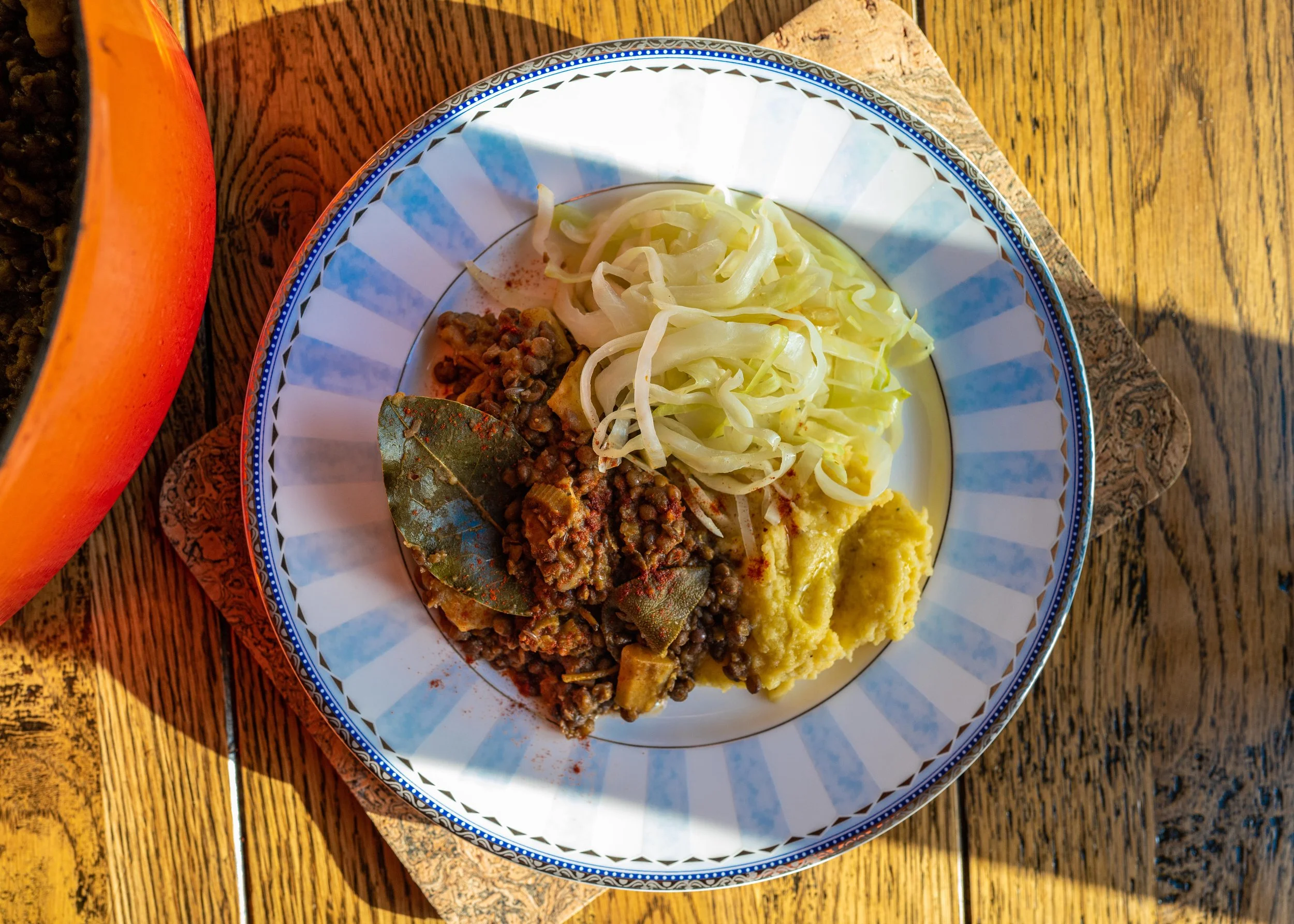 SAGE, PAPRIKA AND CUMIN LENTILS WITH CABBAGE ON GARLIC SWEDE MASH 